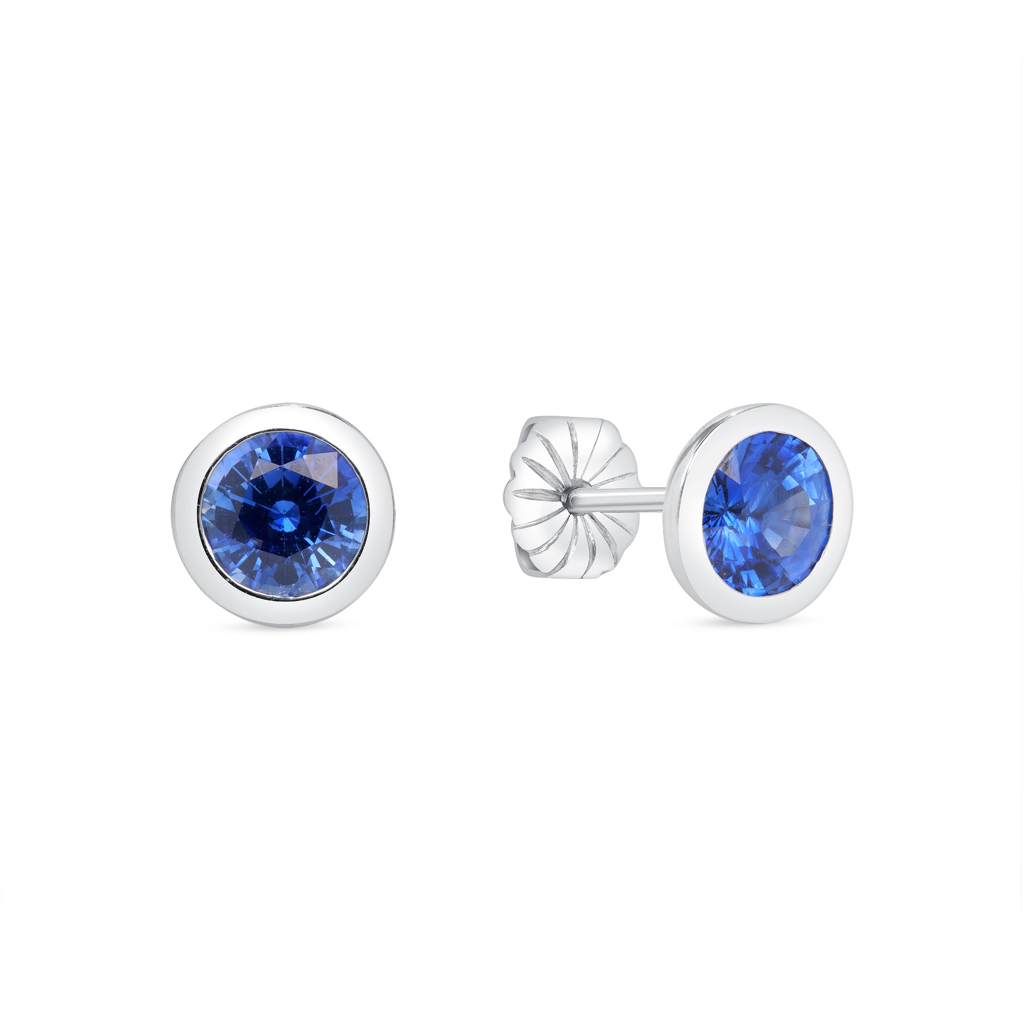 Blue Sapphire Bezel Set Earrings In 18 Karat White Gold