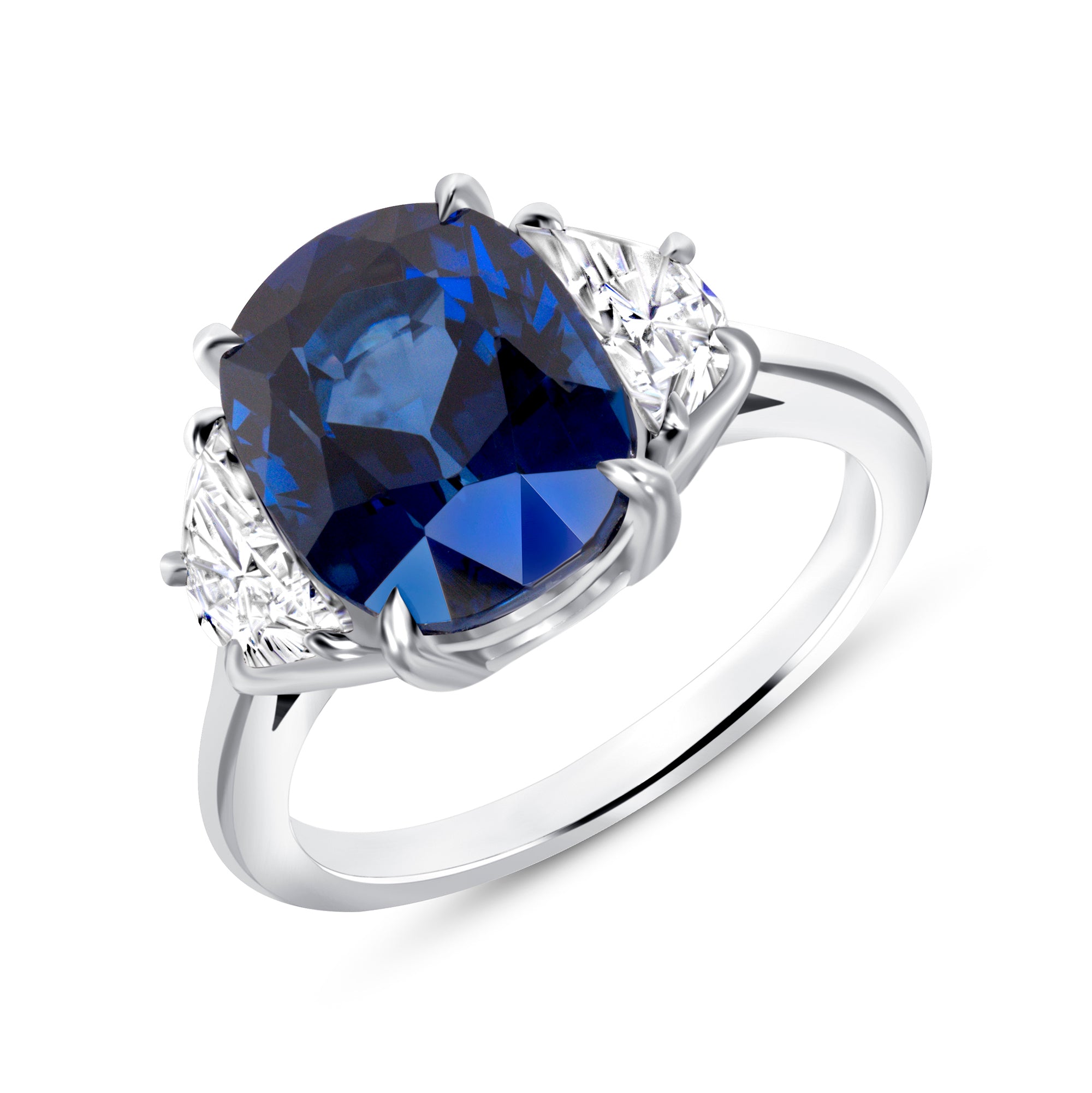 Cushion Cut Blue Sapphire and Trapezoid Cut Diamond Three Stone Ring in Platinum