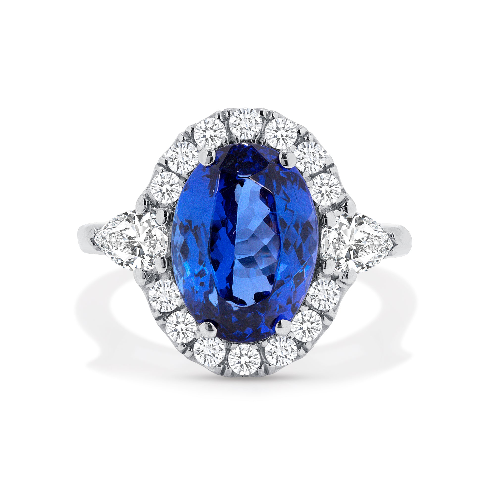 Tanzanite And Pear Shape Diamond Halo Ring In Platinum.