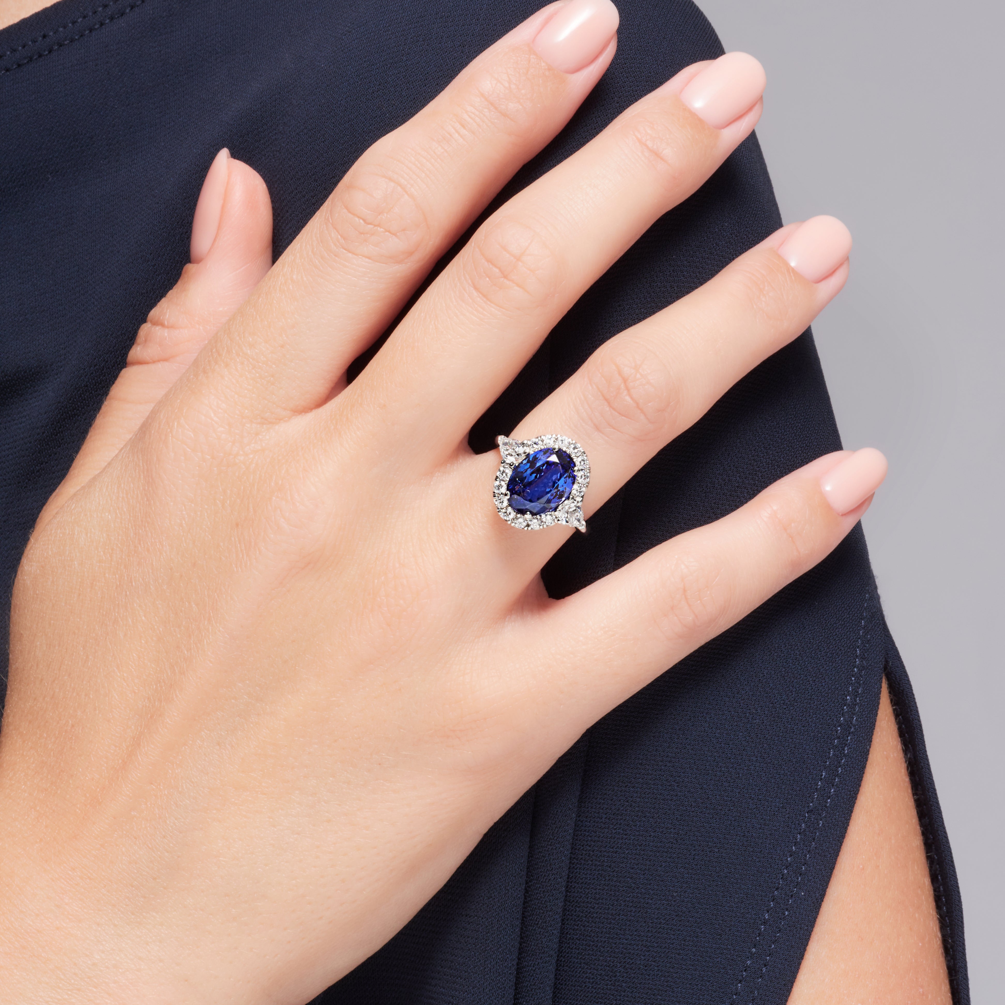 Tanzanite And Pear Shape Diamond Halo Ring In Platinum.