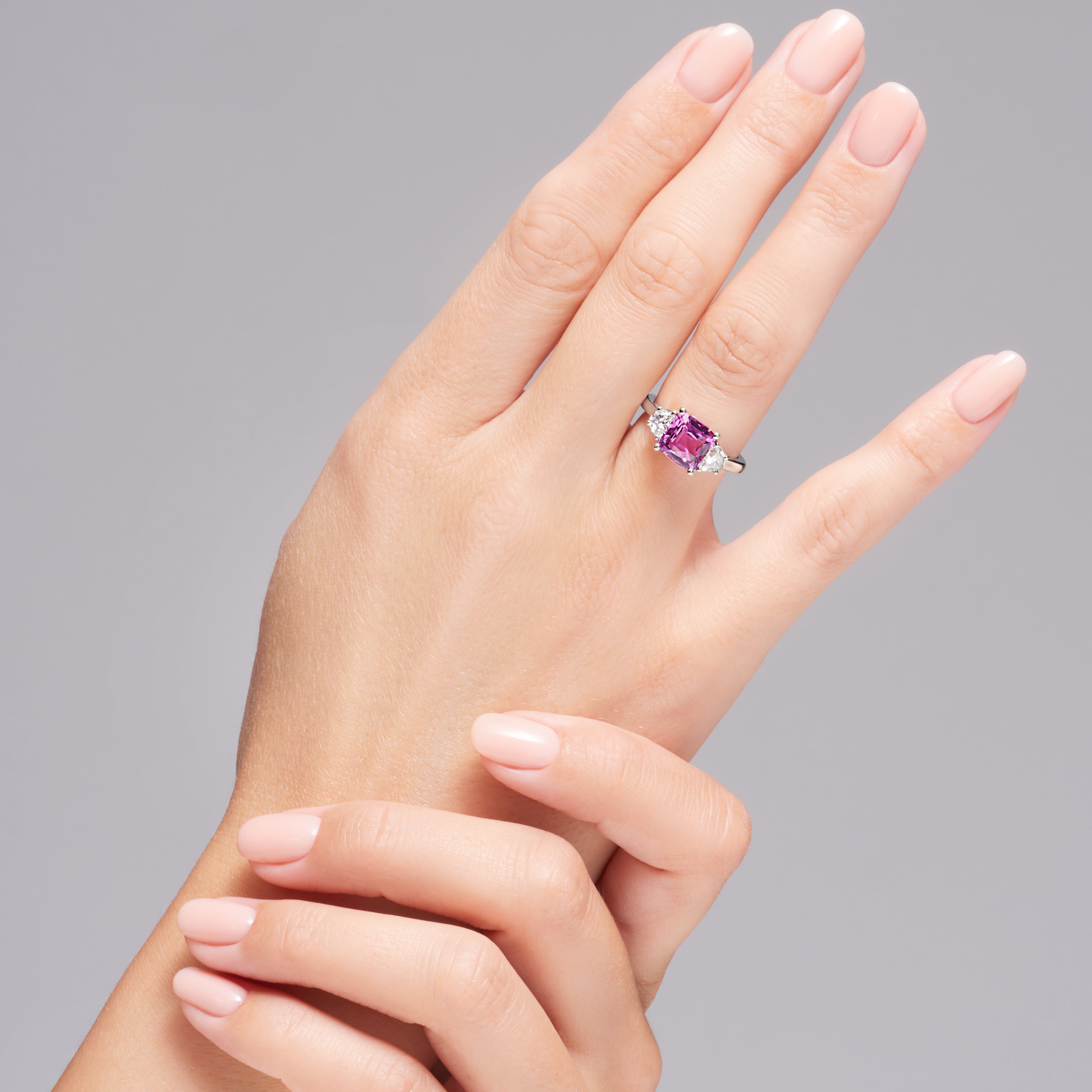 Pink Sapphire And Trapezoid Brilliant Cut Diamond Ring In Platinum