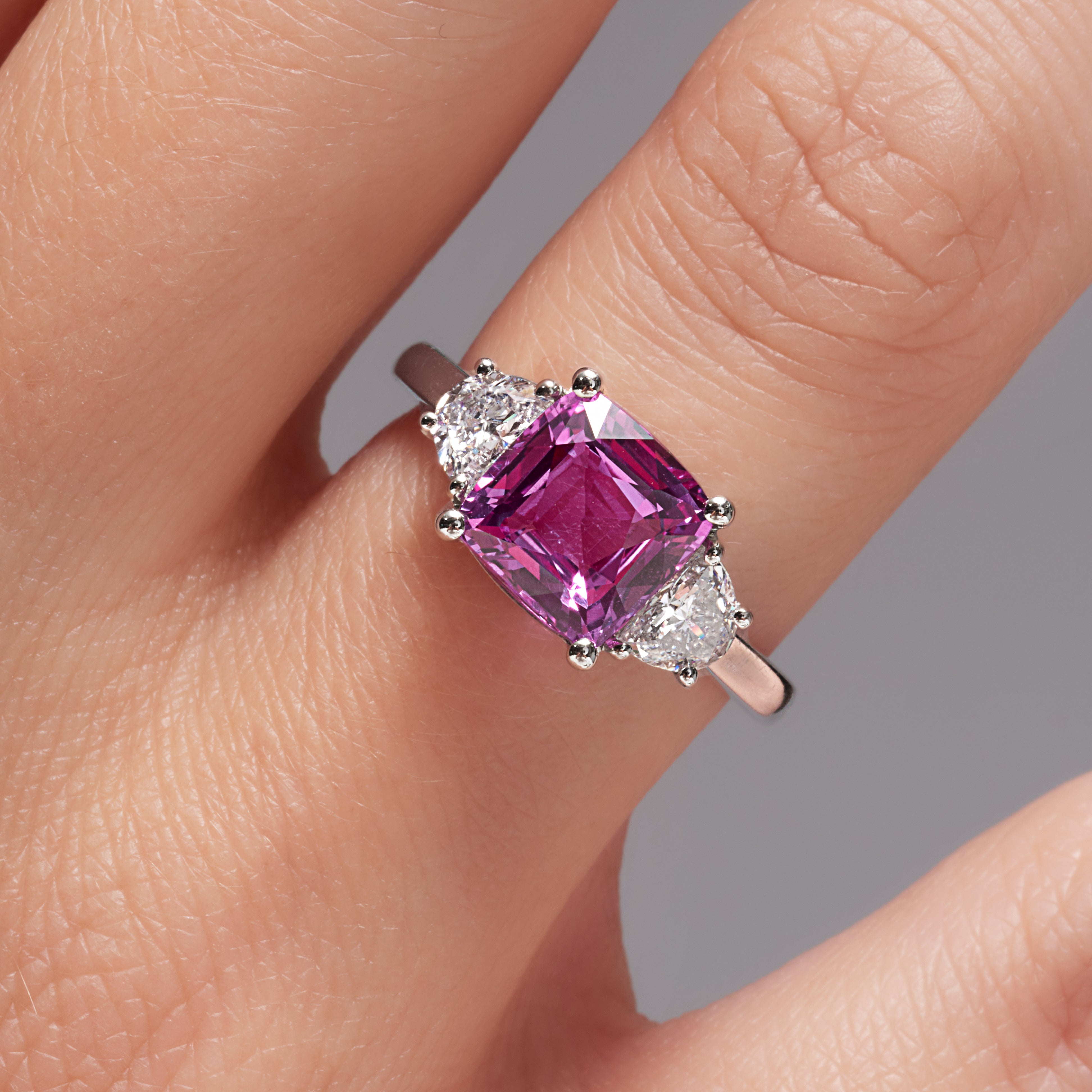 Pink Sapphire And Trapezoid Brilliant Cut Diamond Ring In Platinum