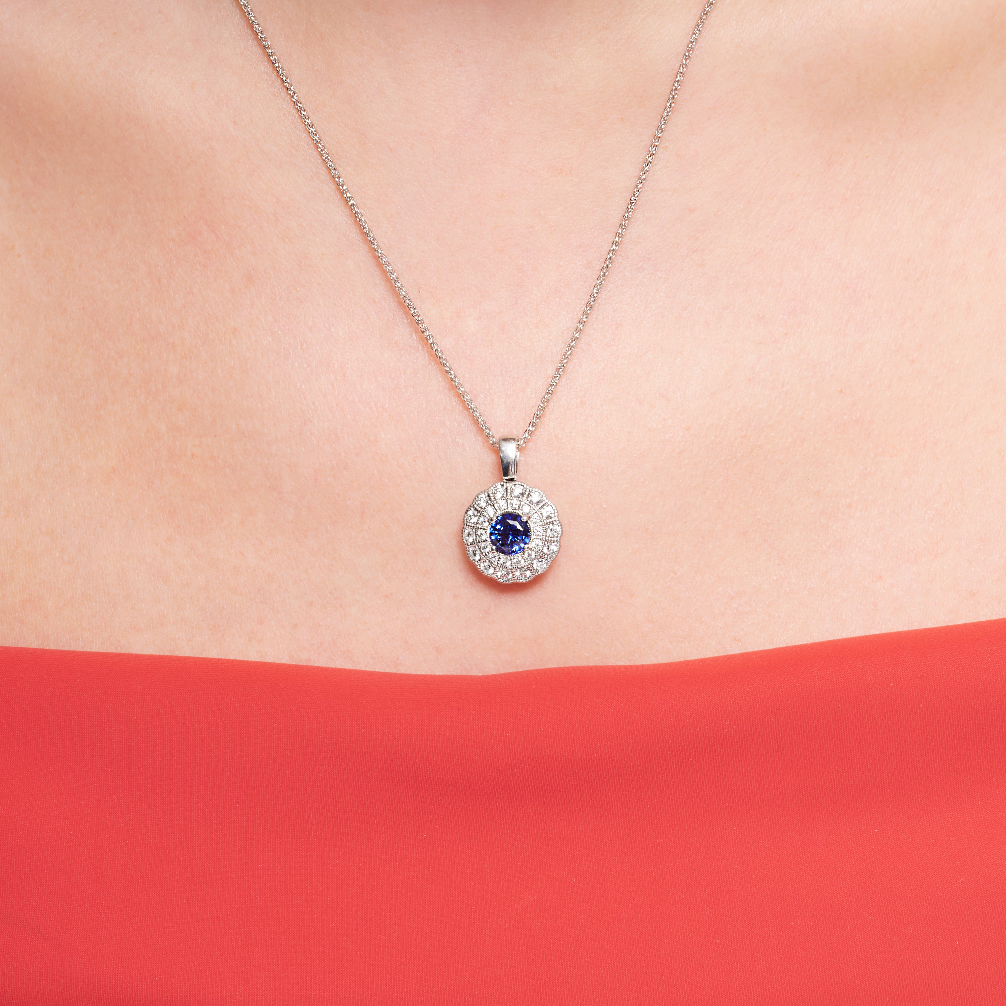 Blue Sapphire And Diamond Halo Pendant In 18 Karat White Gold