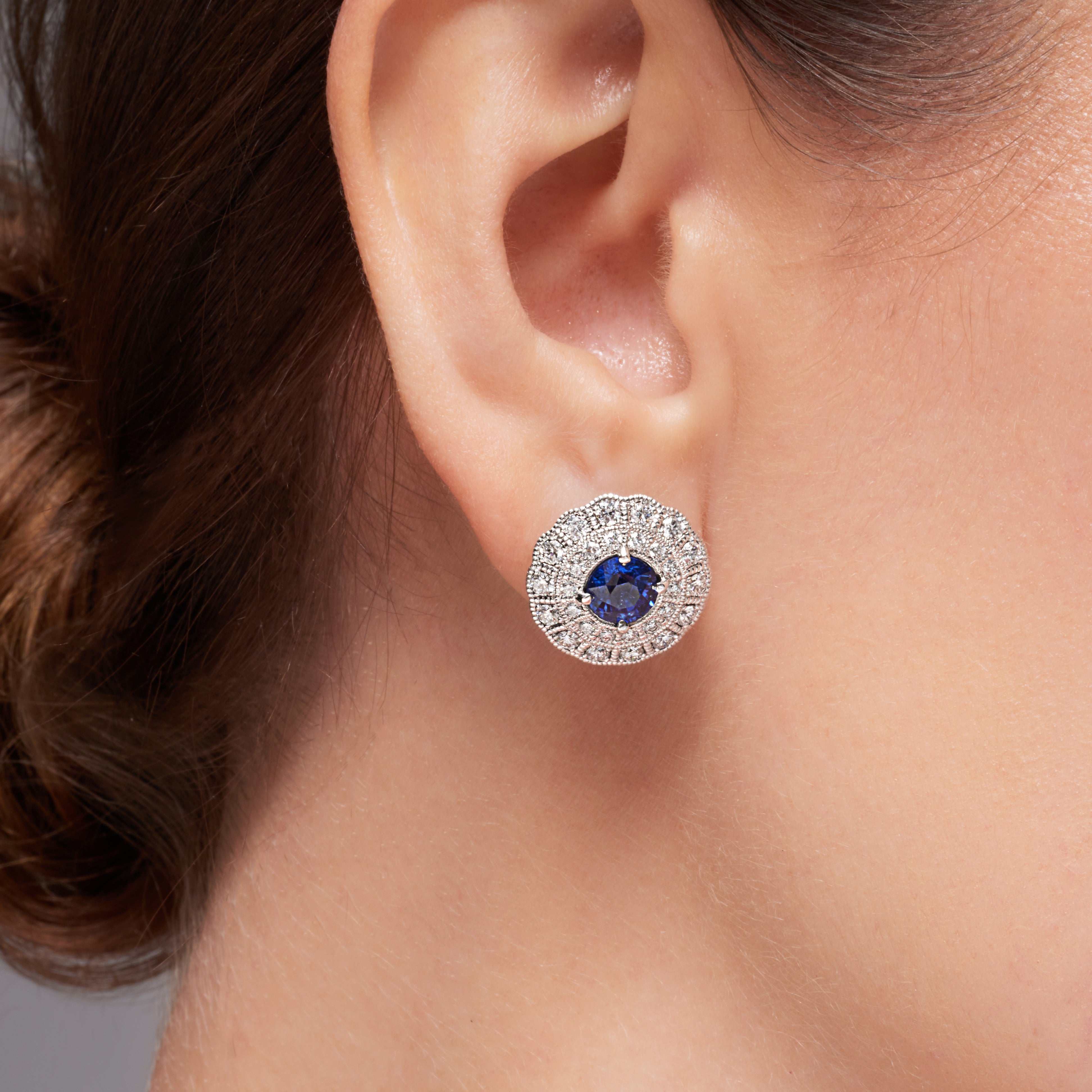 Blue Sapphire And Diamond Halo Earrings In 18 karat white gold