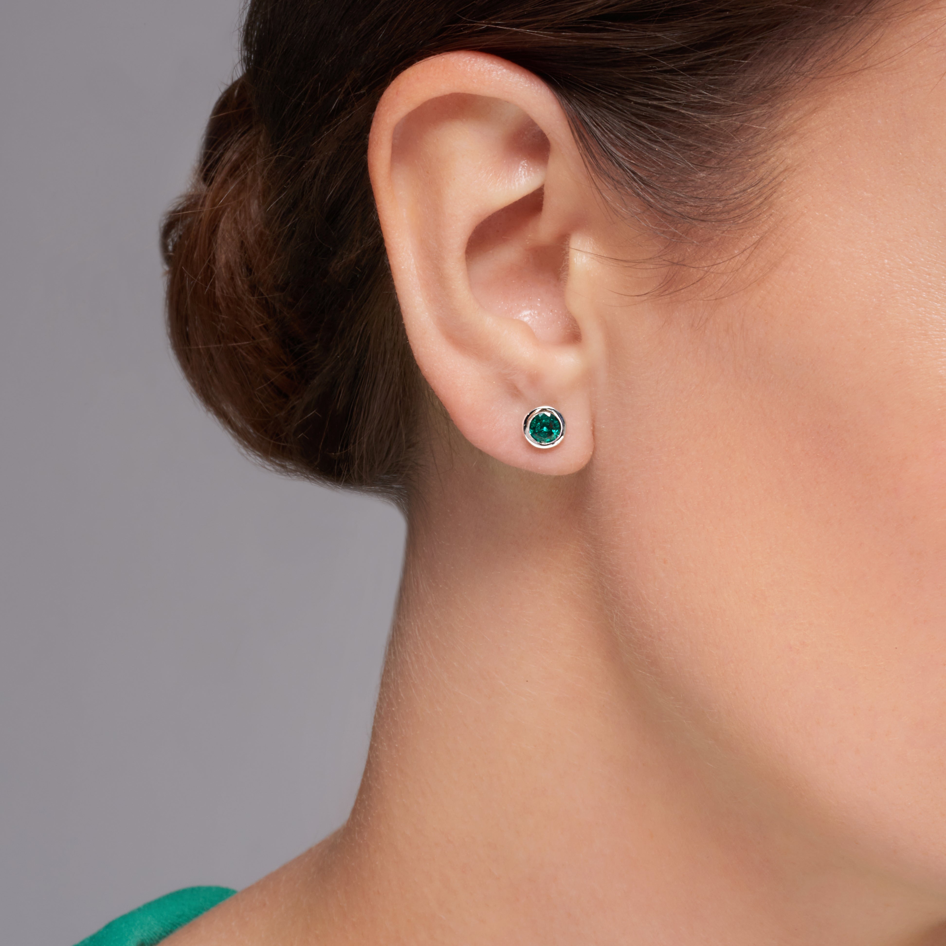 Green Emerald Bezel Set Earrings In 18 Karat White Gold