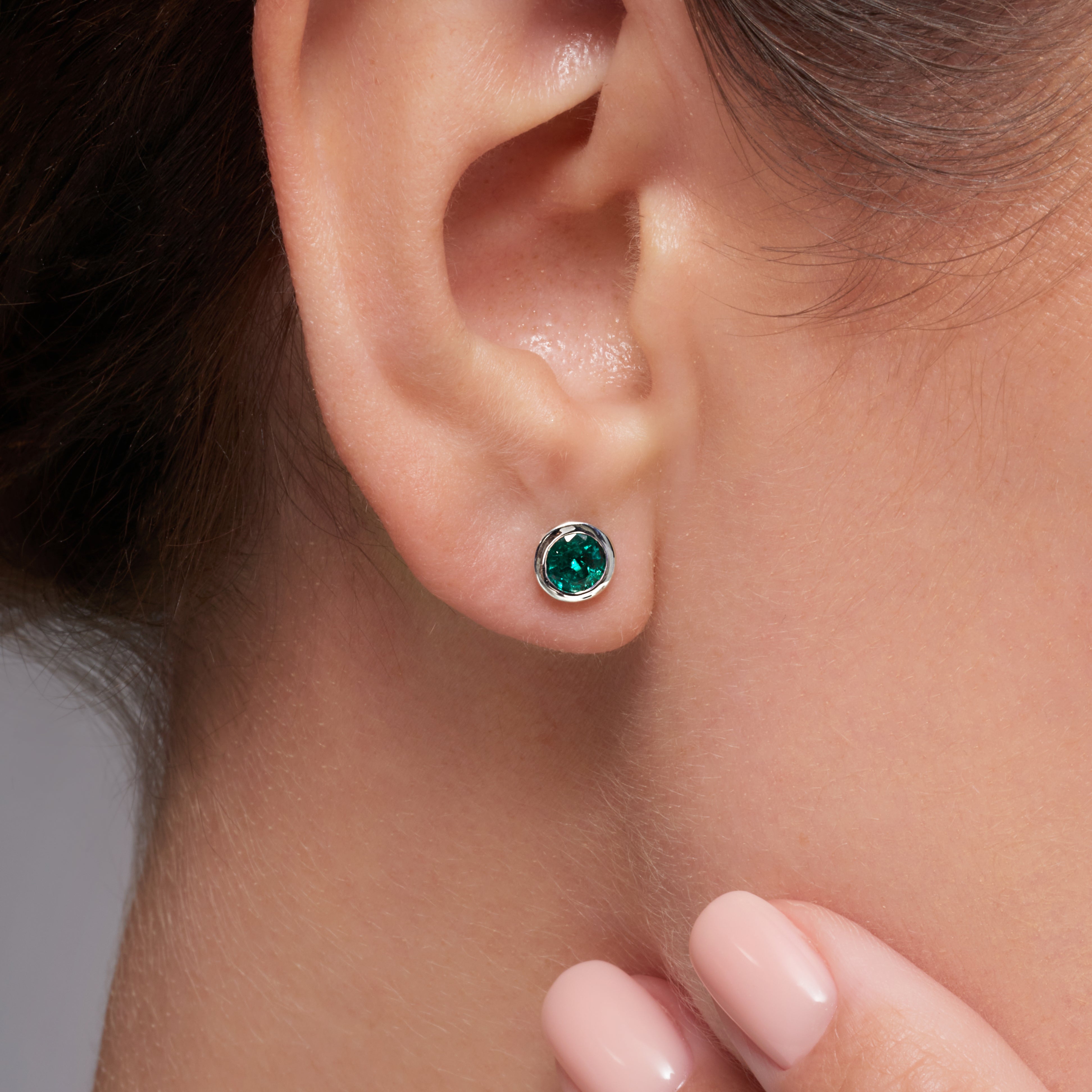 Green Emerald Bezel Set Earrings In 18 Karat White Gold
