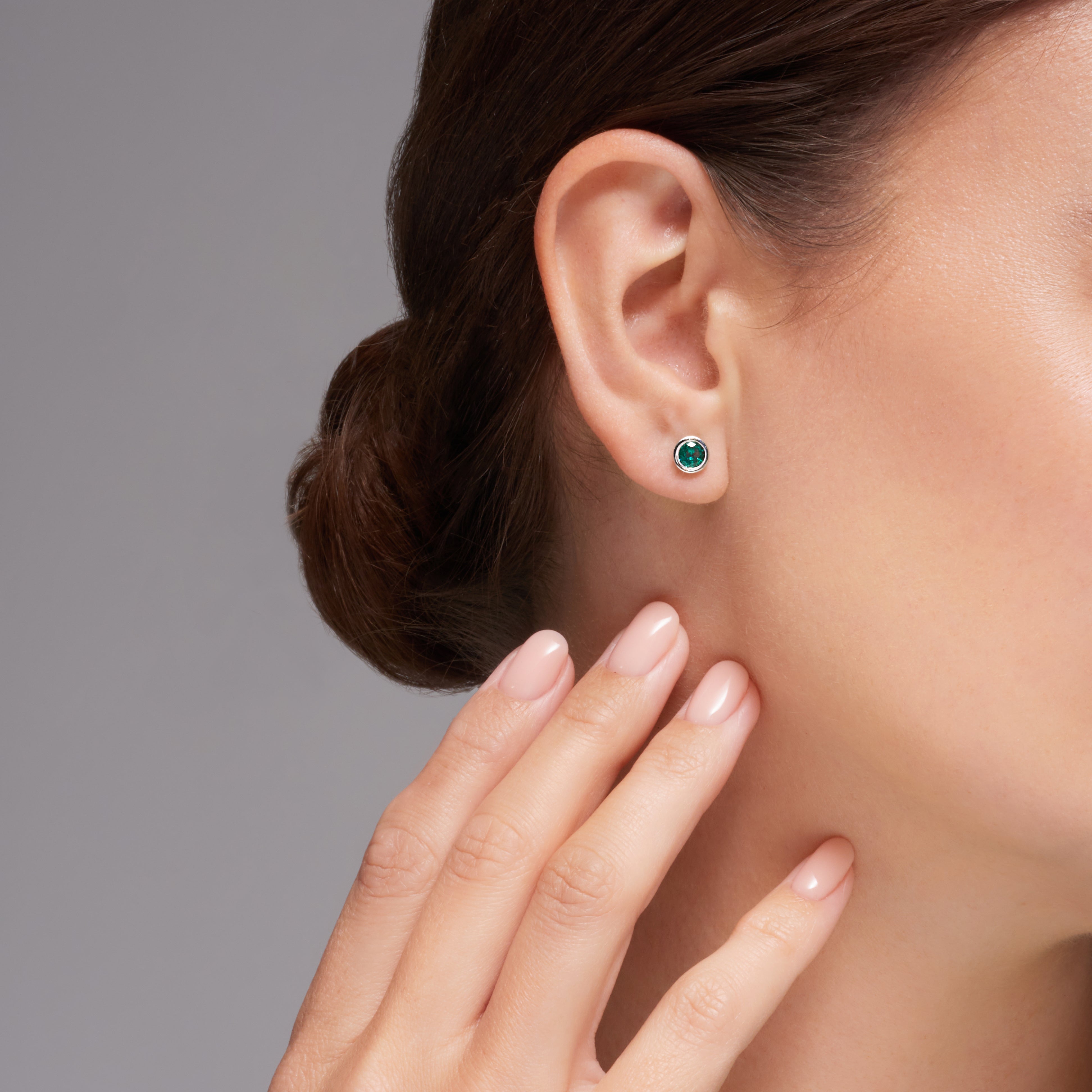 Green Emerald Bezel Set Earrings In 18 Karat White Gold