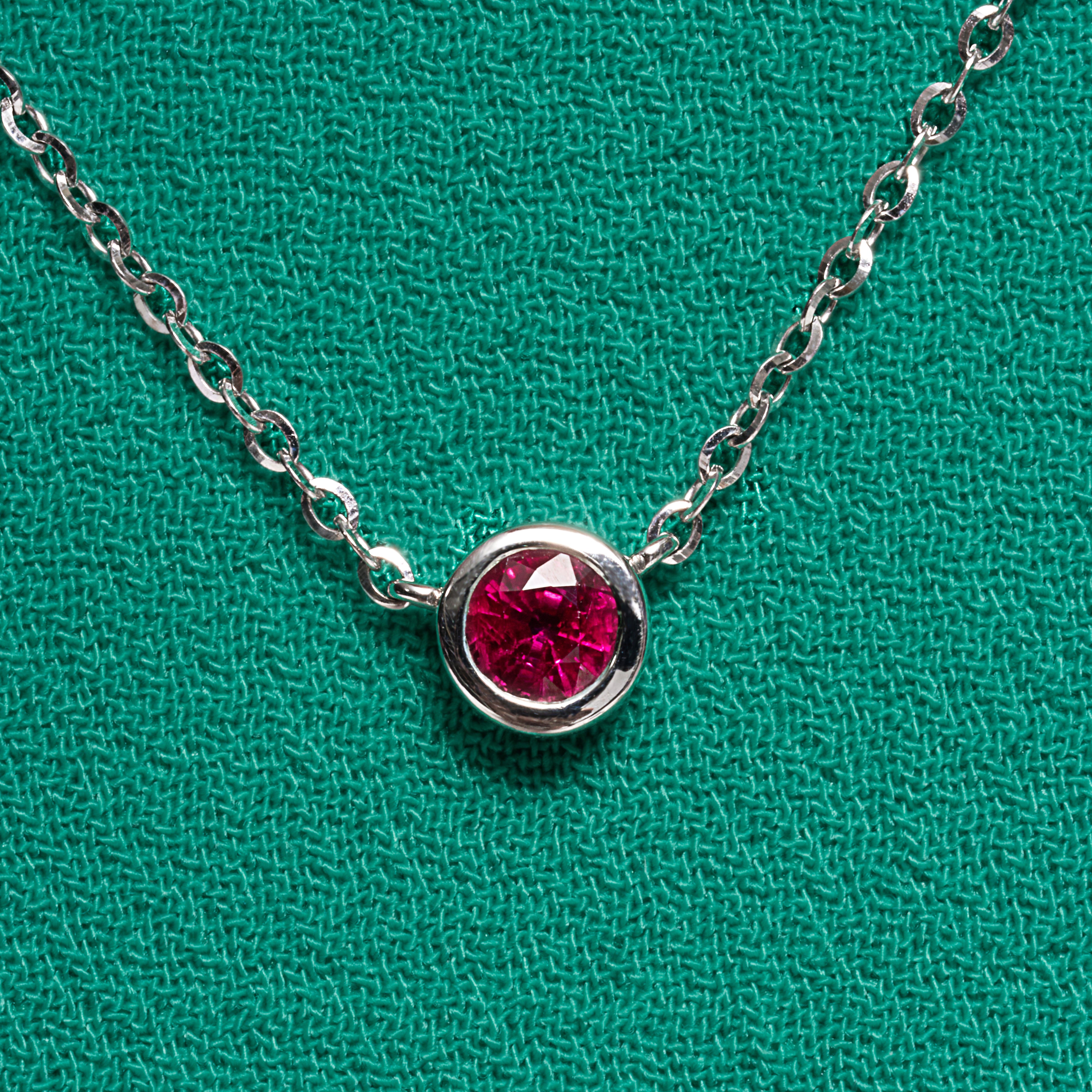 Ruby Bezel Set Pendant In 18 Karat White Gold