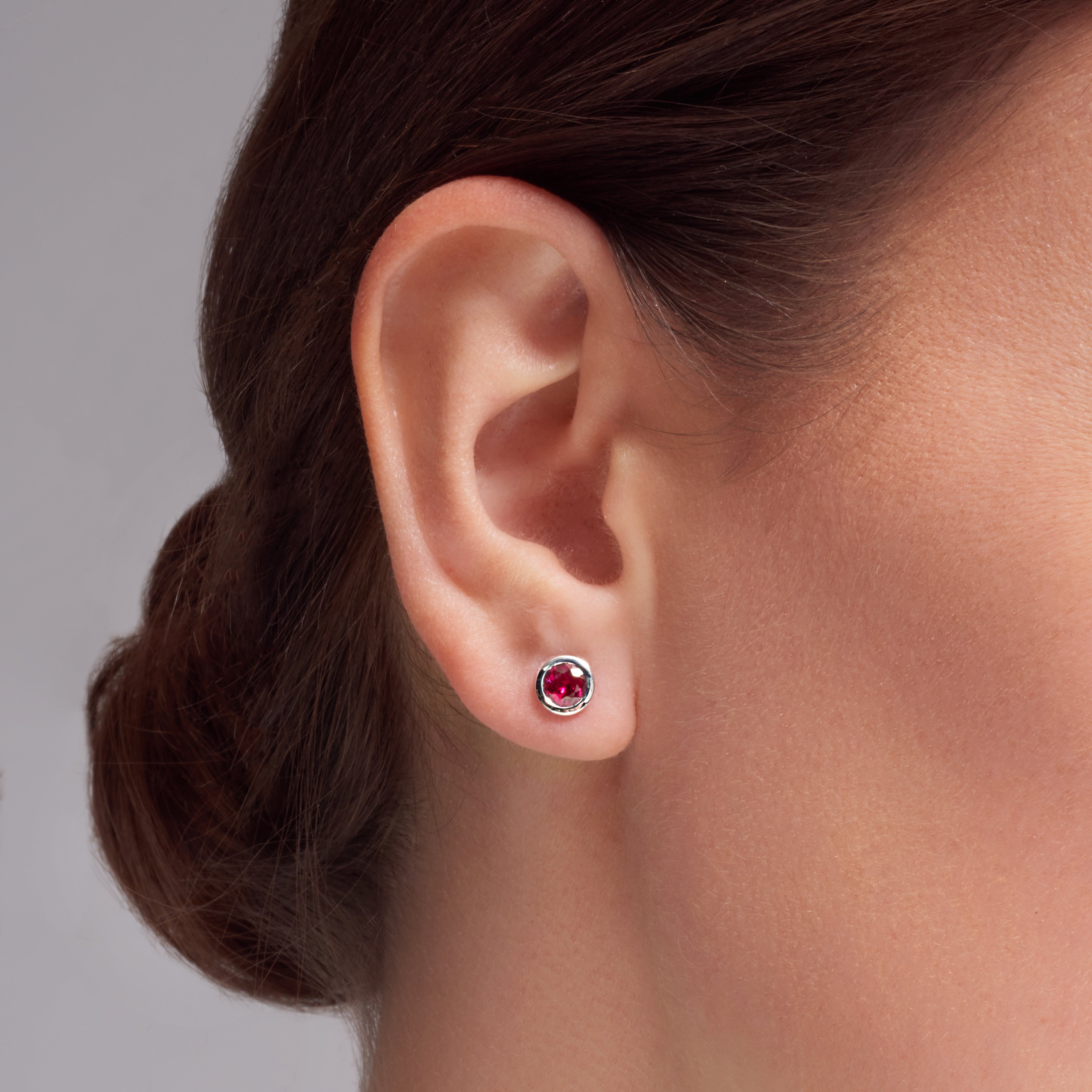 Ruby Bezel Set Earrings In 18 Karat White Gold