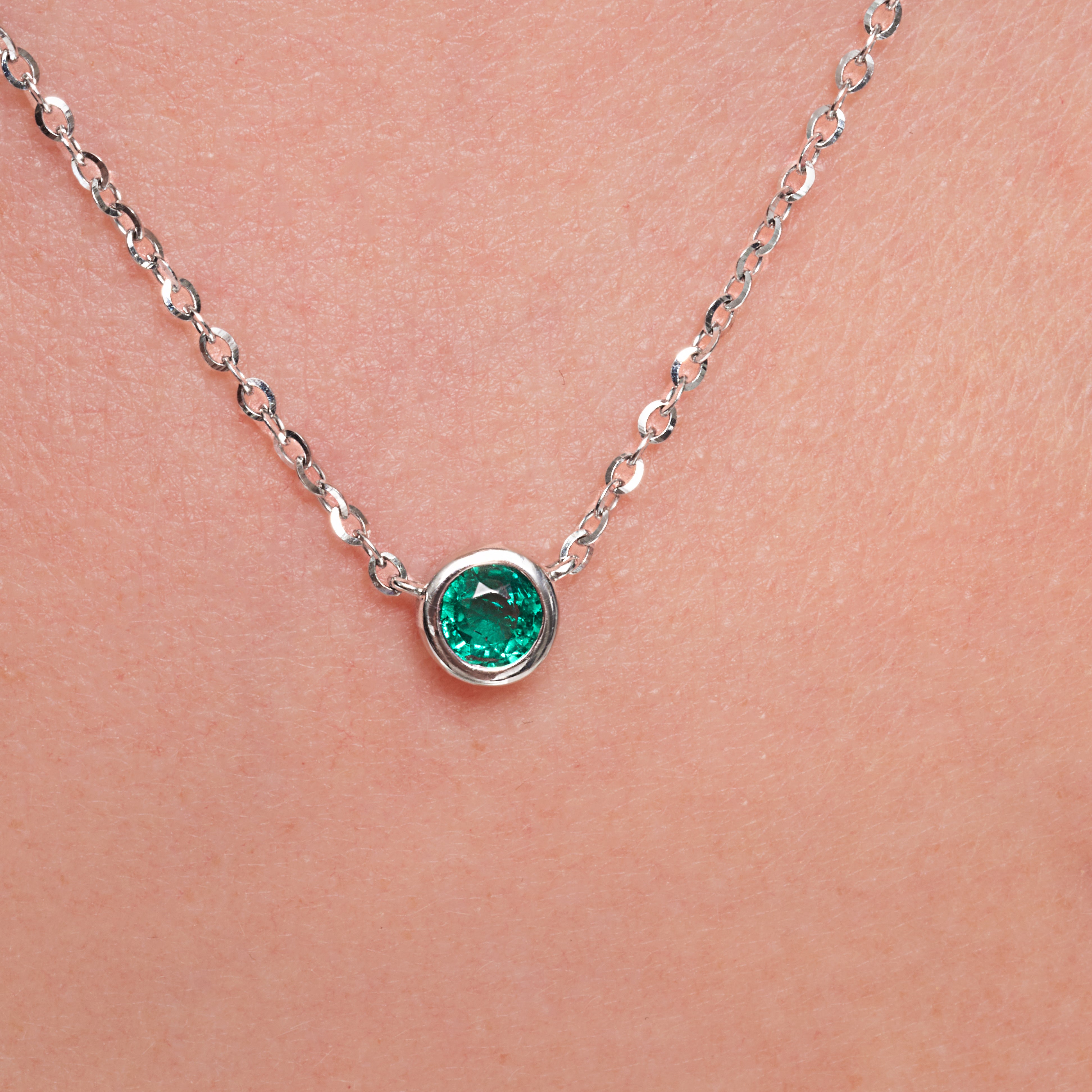 Green Emerald Bezel Set Pendant In 18 Karat White Gold