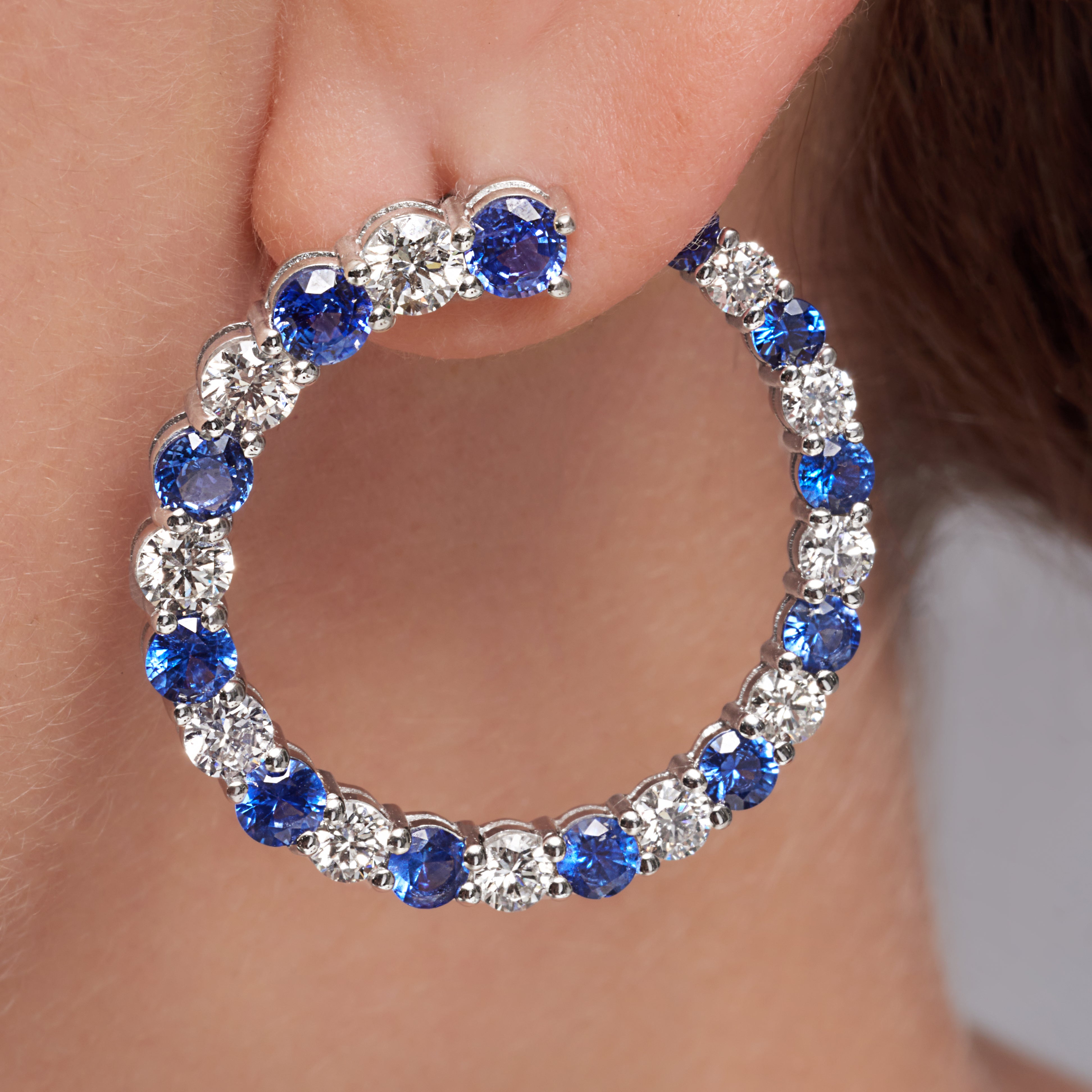 Diamond And Blue Sapphire Circle Earrings In 18 Karat White Gold