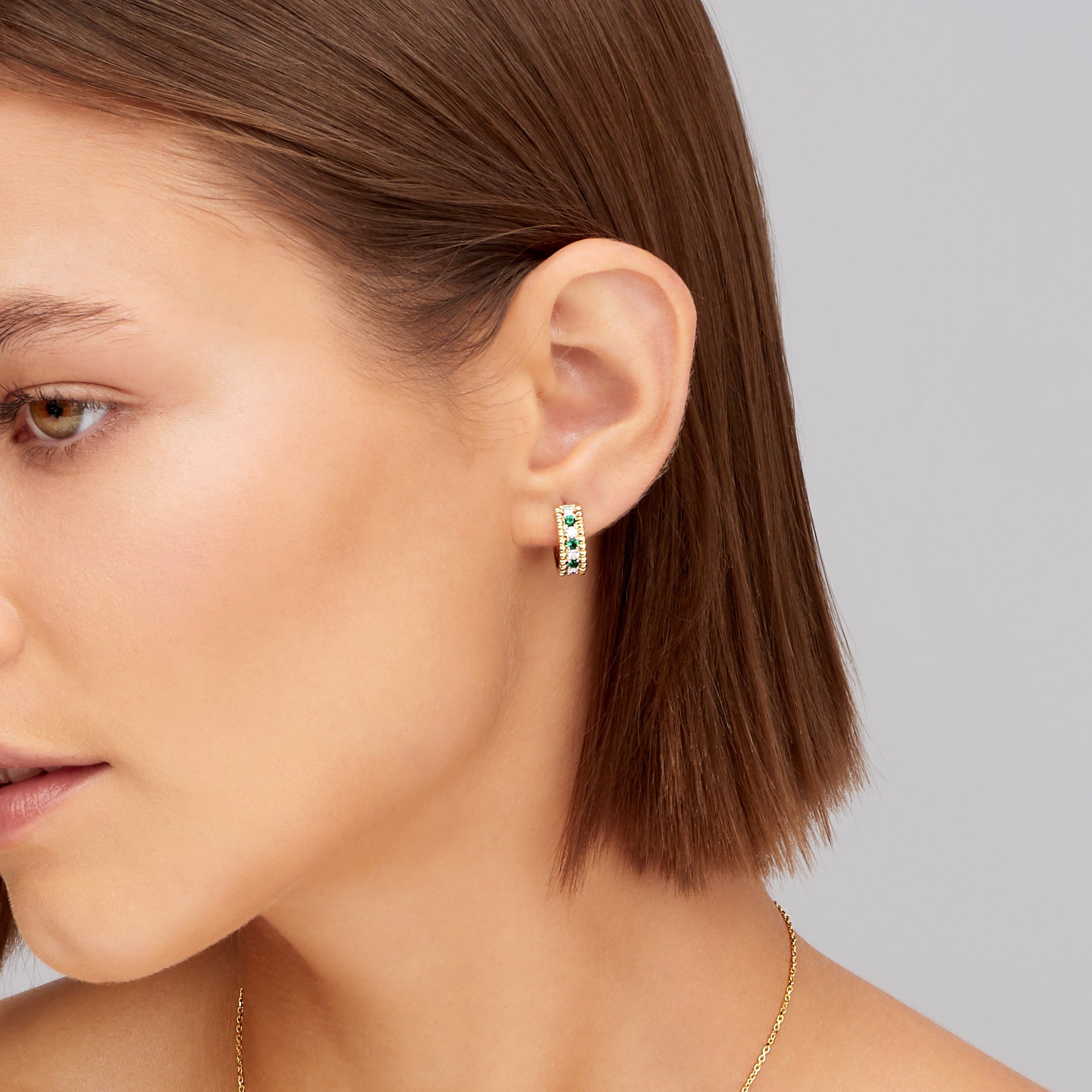 Alternating Diamond and Emerald Huggie Earrings in 18K Yellow Gold