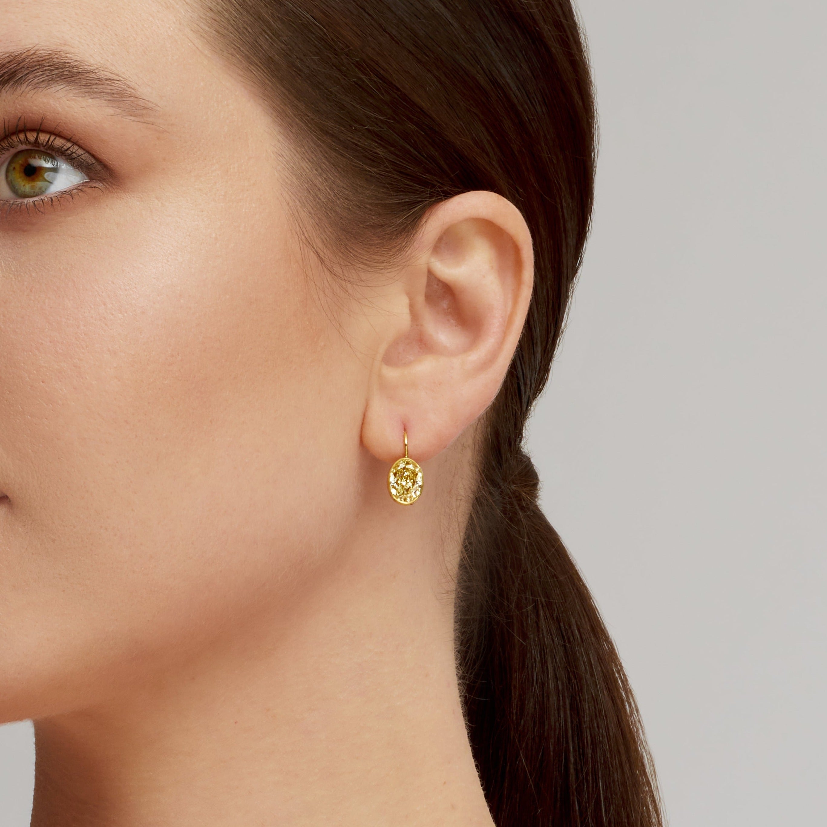 Oval Cut Bezel Set Fancy Yellow Diamond Dangle Earrings in 18 Karat Yellow Gold