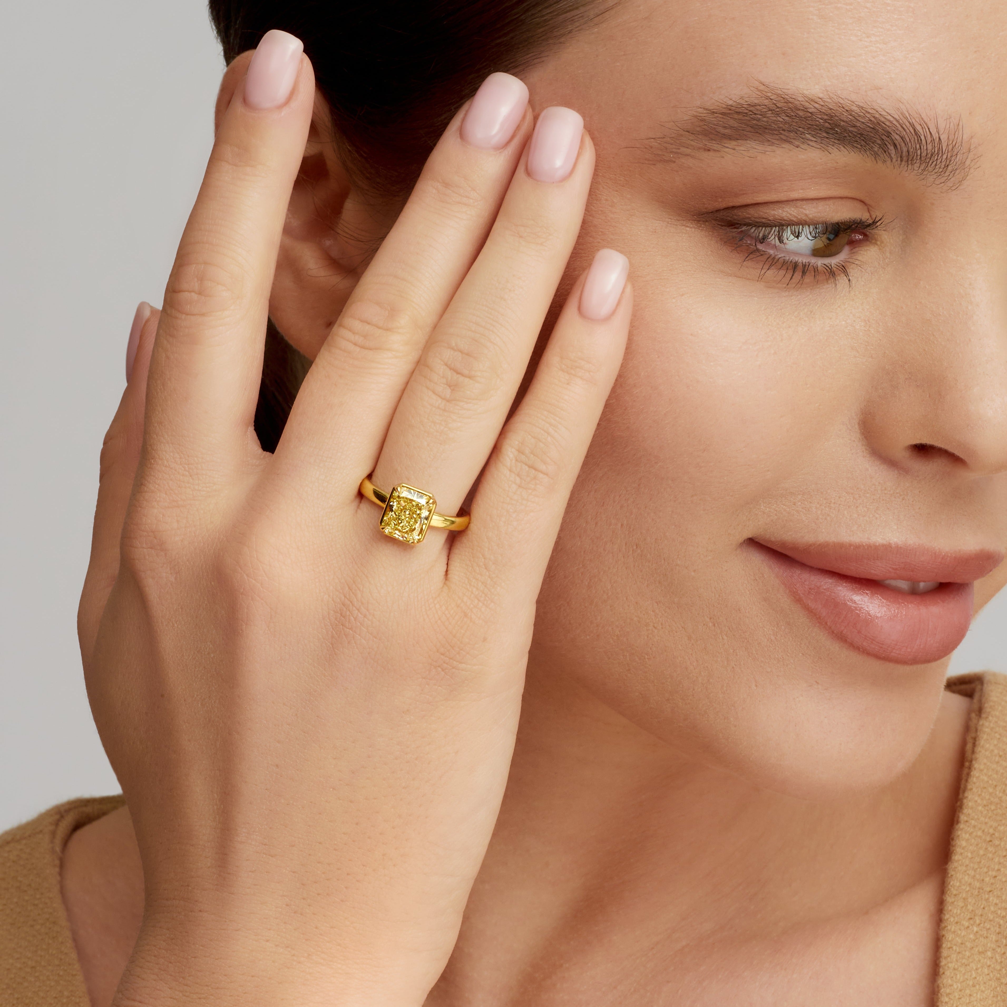 Radiant Cut Fancy Yellow Diamond Solitaire Ring in 18 Karat Yellow Gold