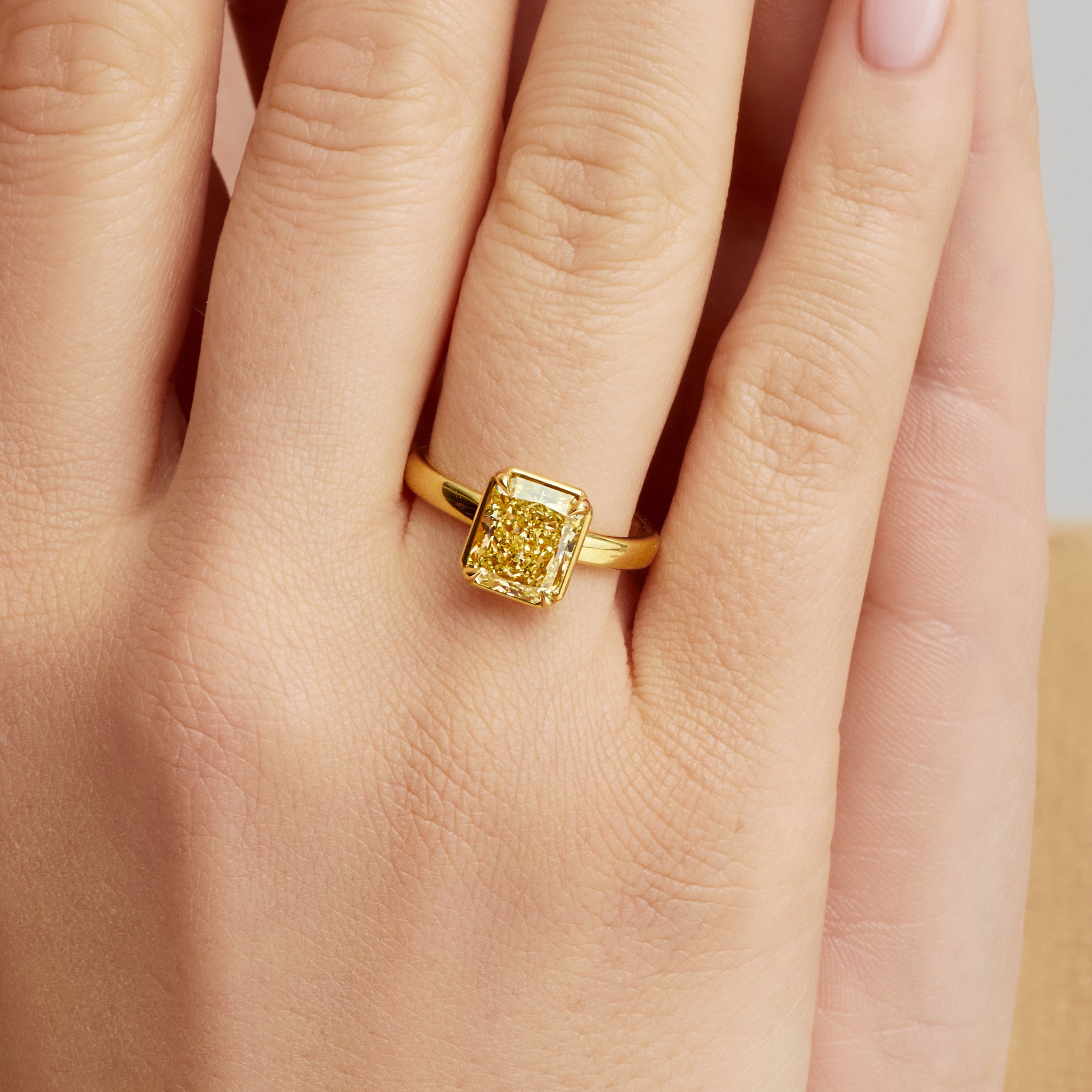 Radiant Cut Fancy Yellow Diamond Solitaire Ring in 18 Karat Yellow Gold