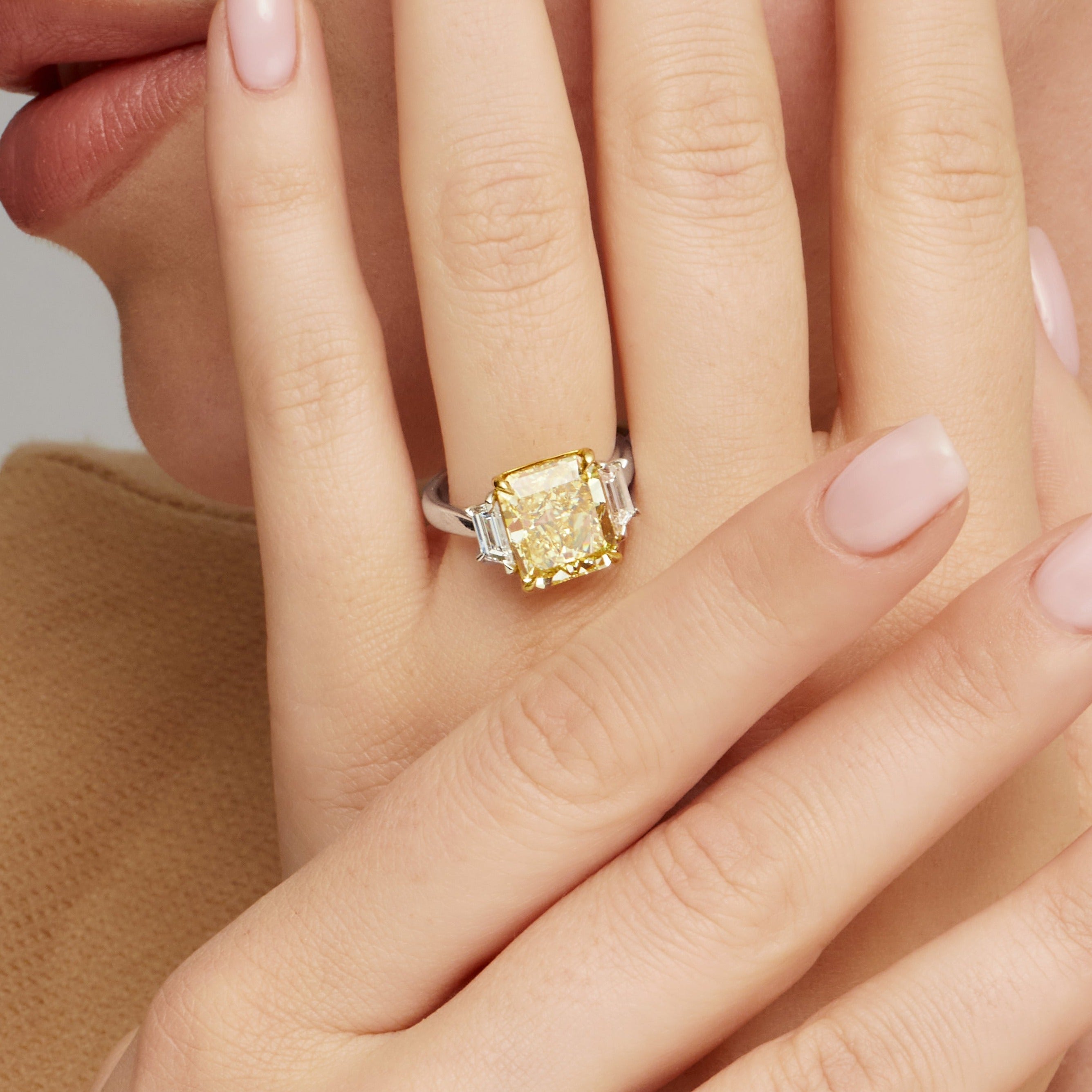 Radiant Cut Fancy Intense Yellow Diamond and Trapezoid Diamond Side Stones Ring in 18 Karat Yellow Gold and Platinum