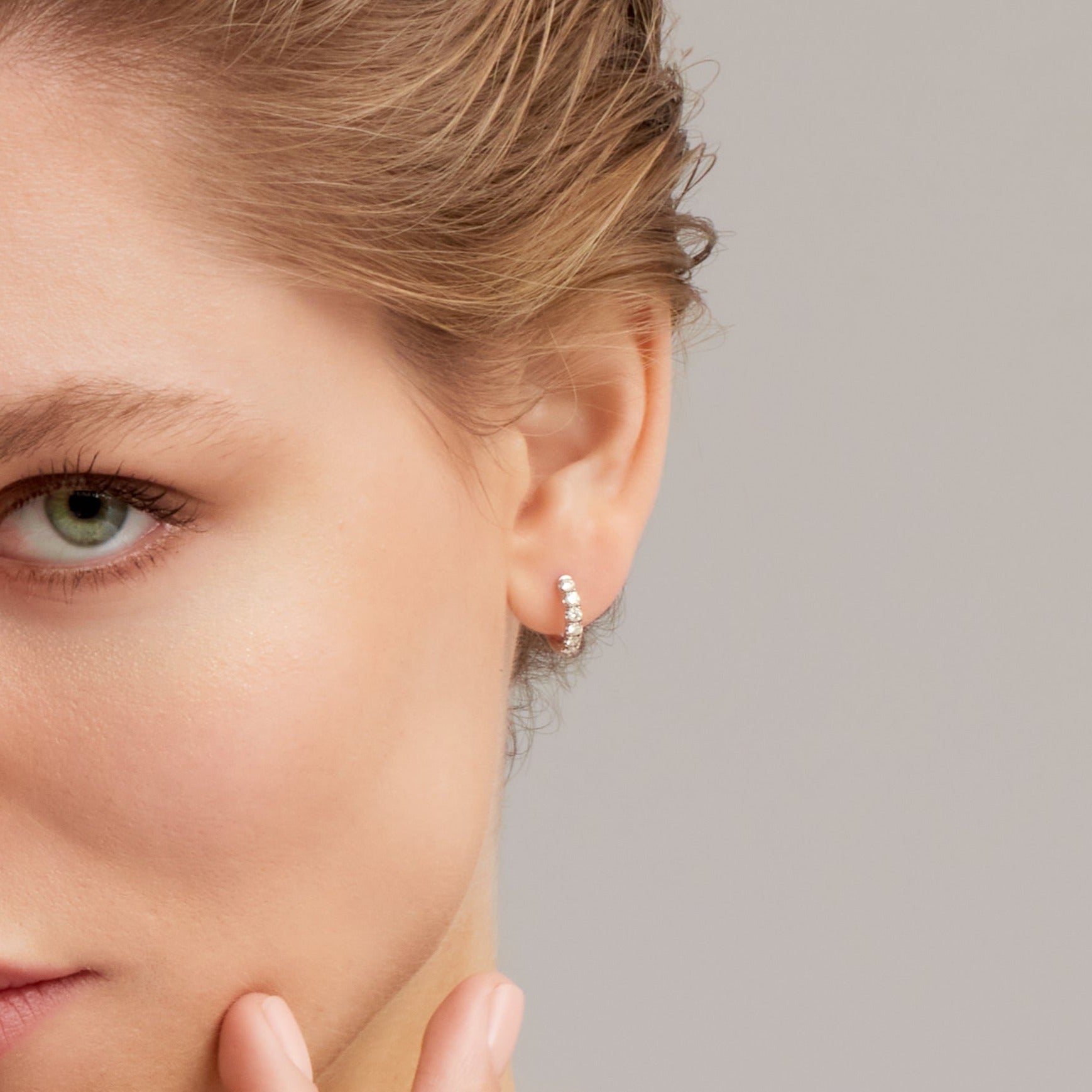 Round Cut Diamond Huggie Hoop Earrings in White Gold