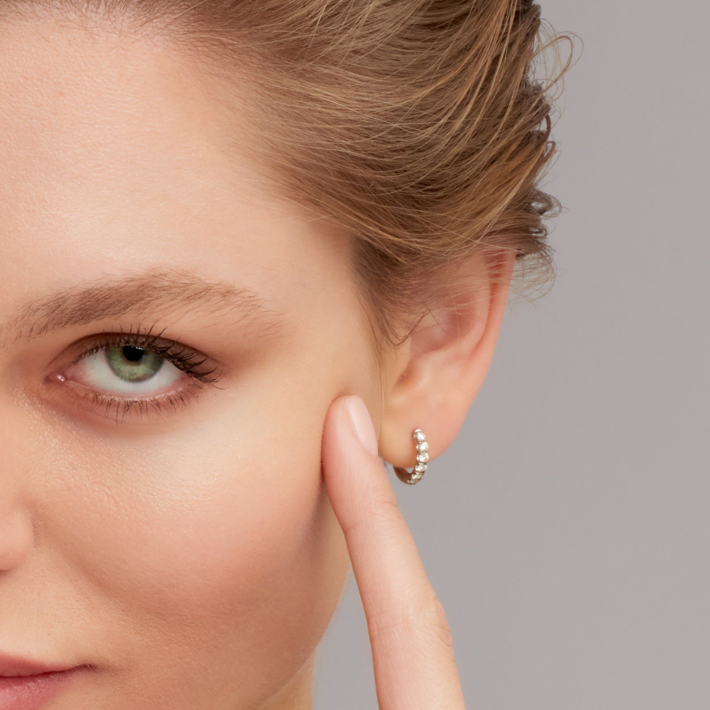 Round Cut Diamond Huggie Hoop Earrings in White Gold