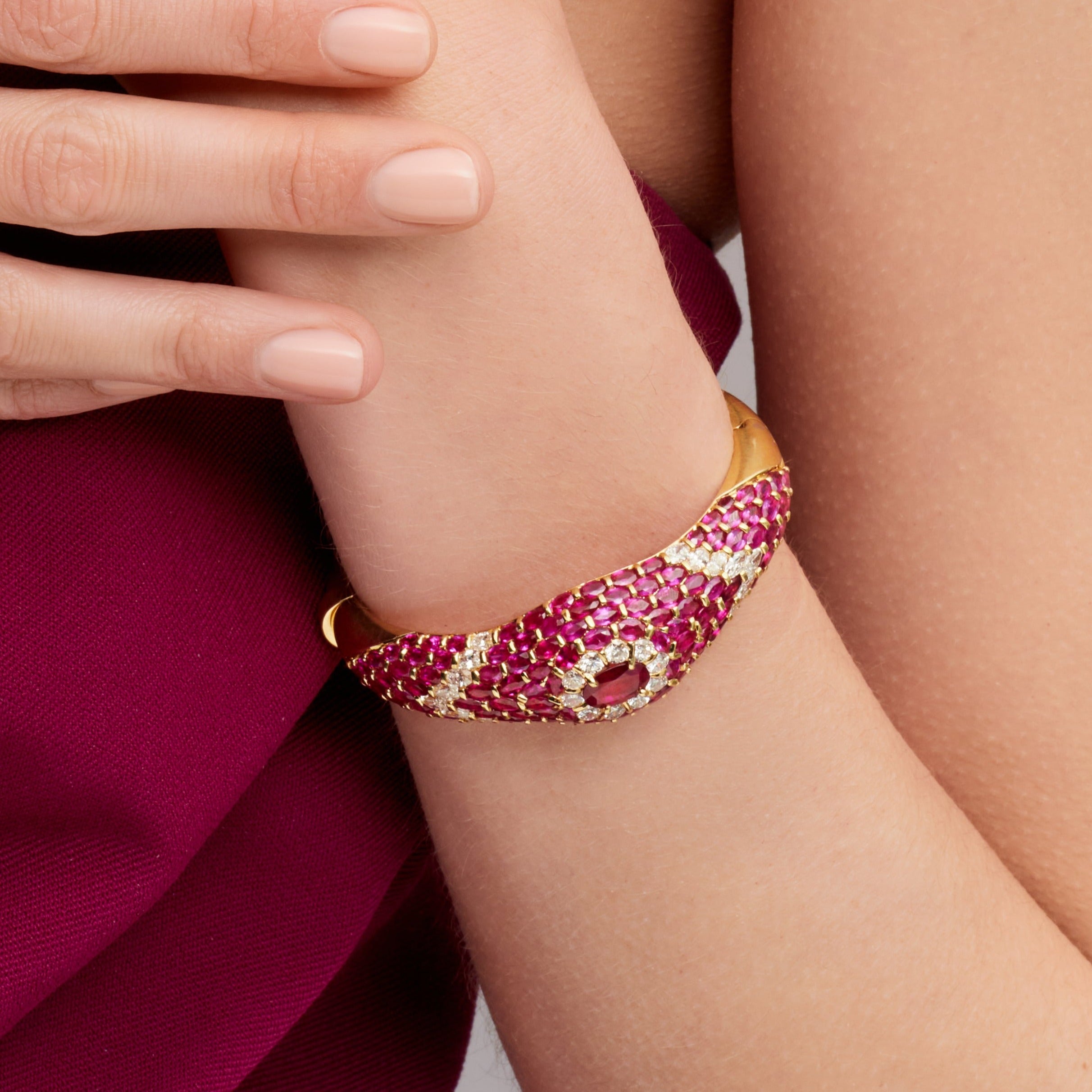 Oval Cut Ruby Cuff Bracelet with Diamond Accents in Yellow Gold