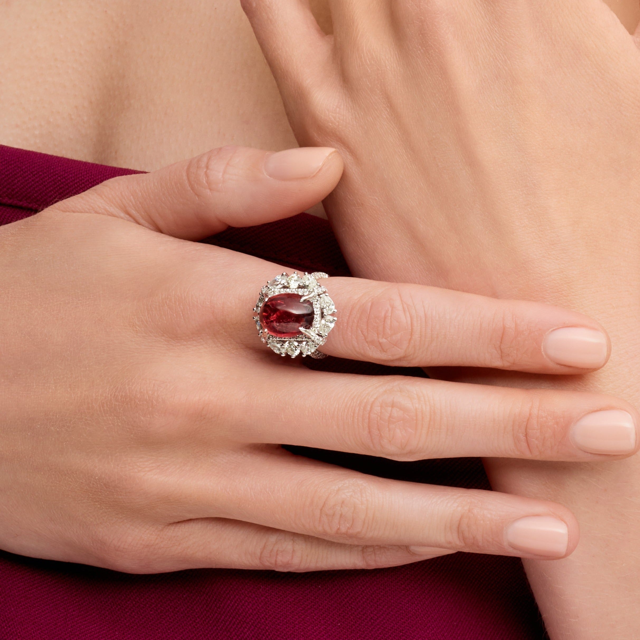 Oval Cut Ruby Cabochon Ring With A Diamond Halo In Platinum Ruthenium