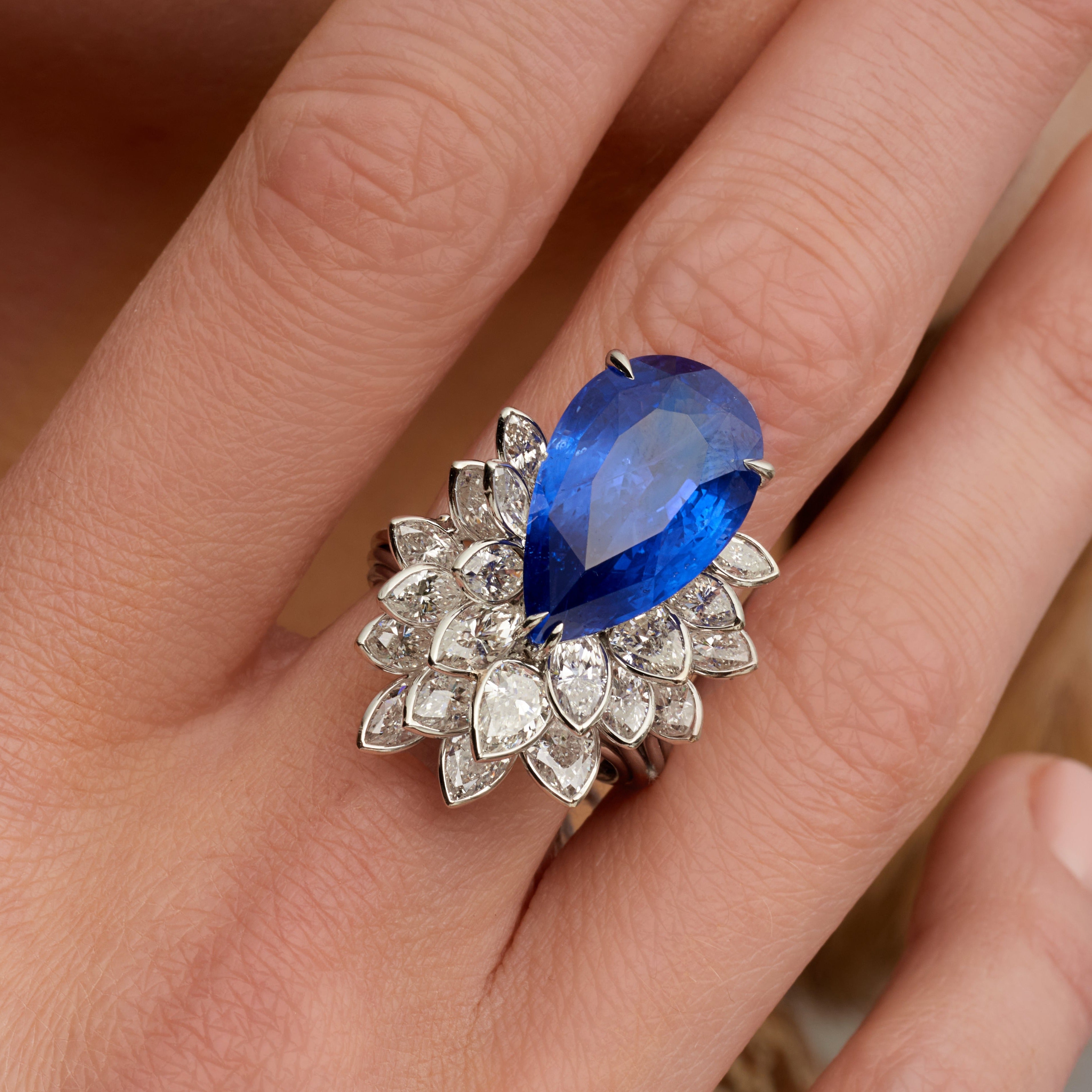 Pear Shape Blue Sapphire Ring with Pear & Marquise Cut Layered Bezel Set Diamonds in Platinum Ruthenium