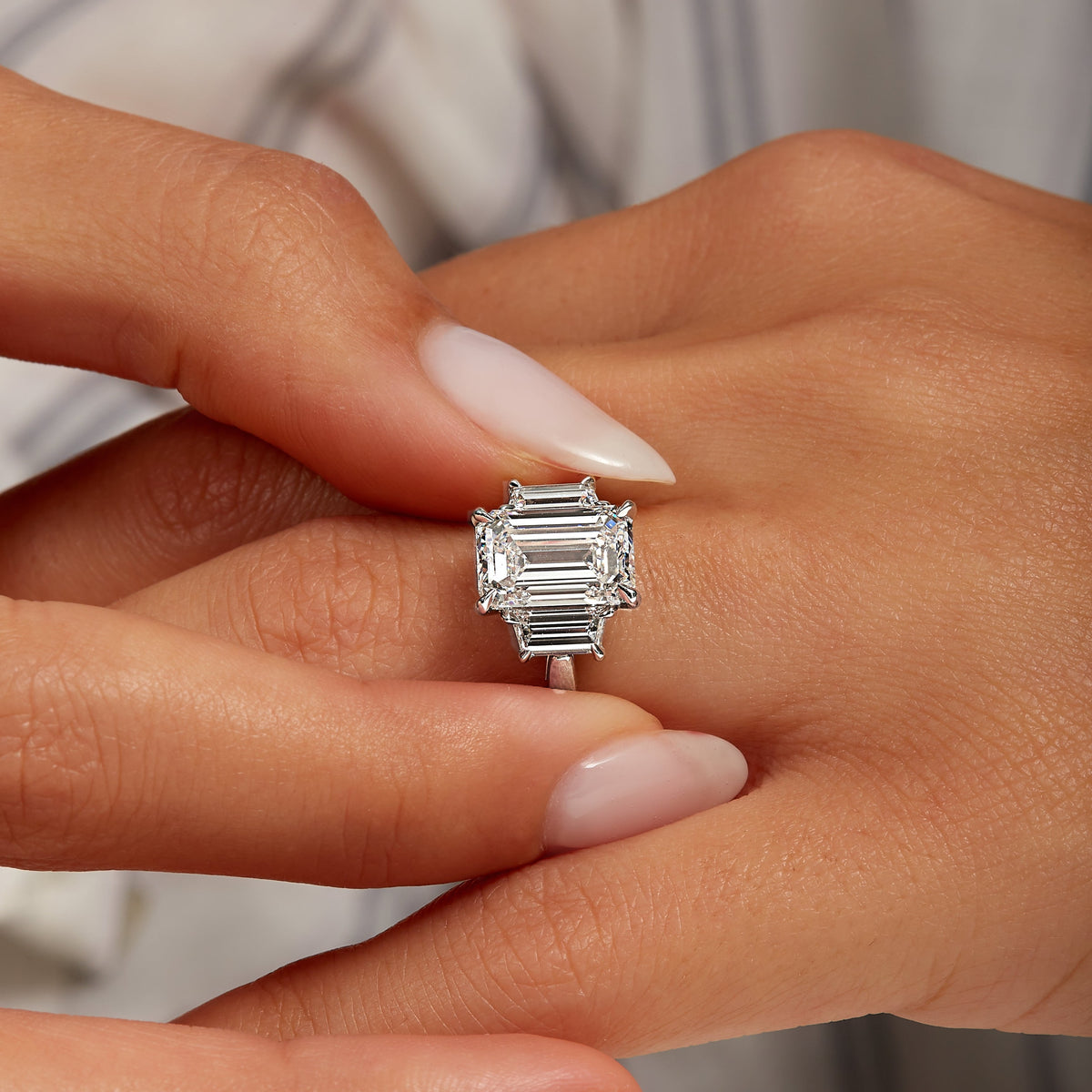 4.01ct Emerald Cut Diamond Three Stone Ring with Trapezoid Side Stones in Platinum Band, GIA Certified