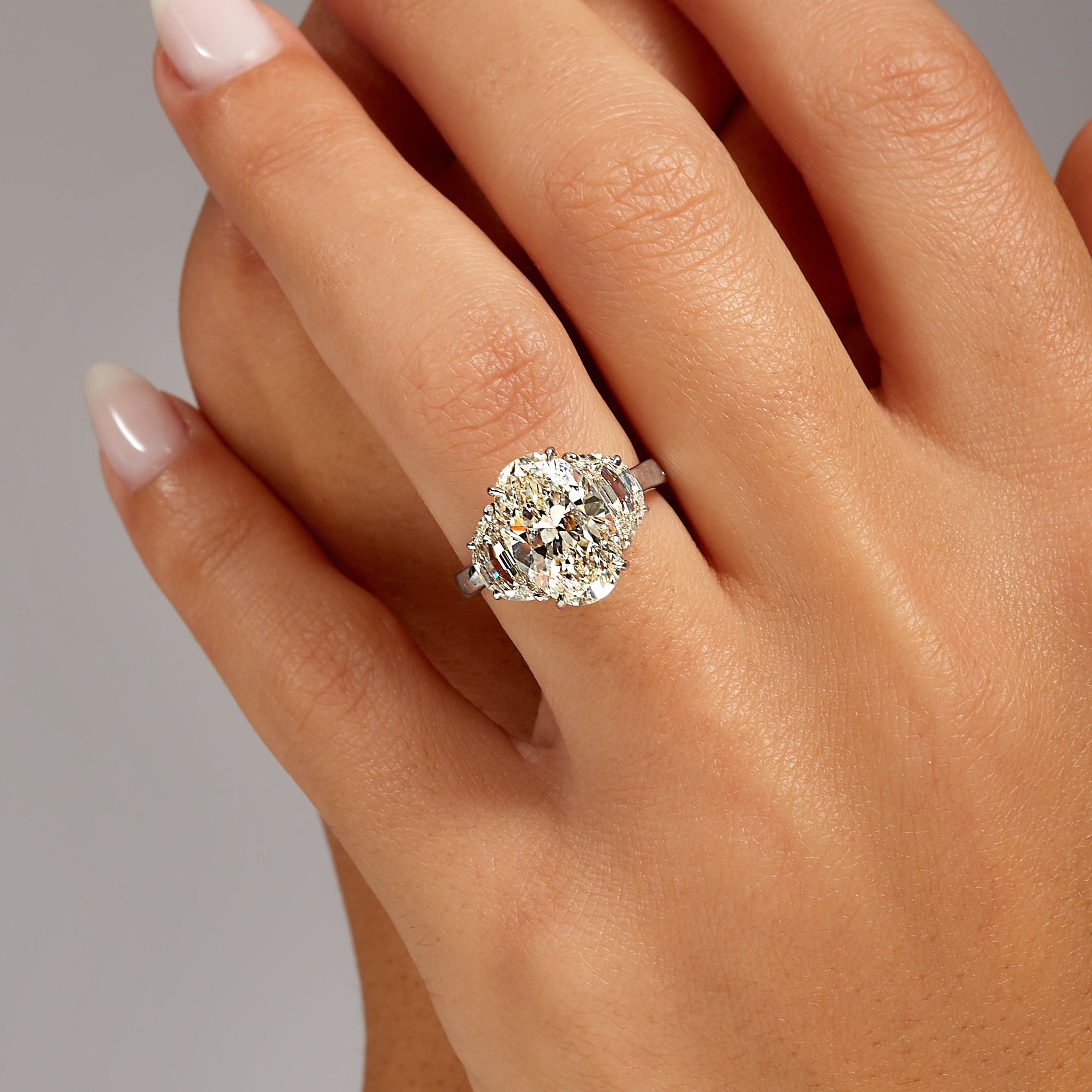 4.22ct Oval Cut Diamond with Brilliant-Cut Trapezoid Side Stones in Platinum Band, GIA Certified