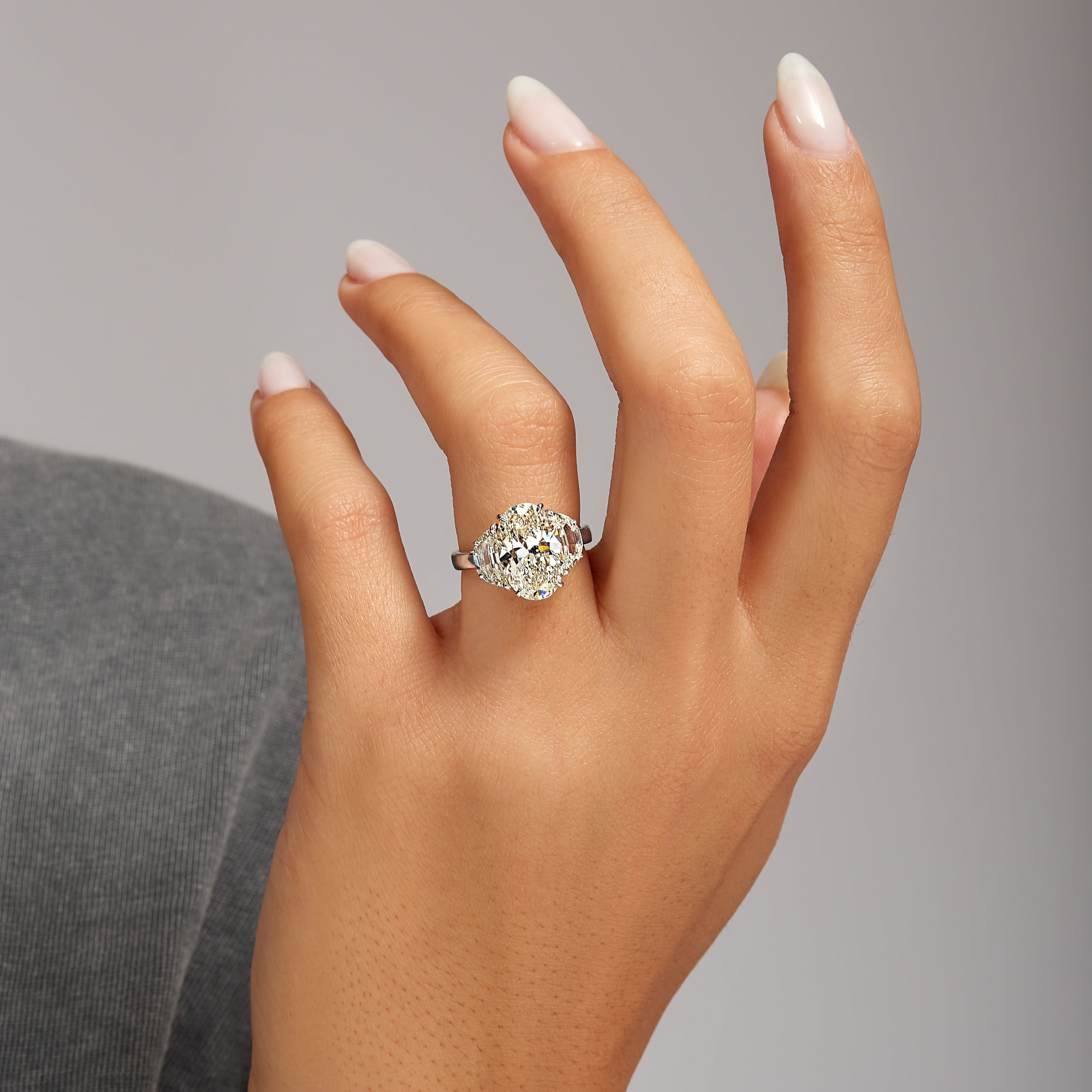 4.22ct Oval Cut Diamond with Brilliant-Cut Trapezoid Side Stones in Platinum Band, GIA Certified