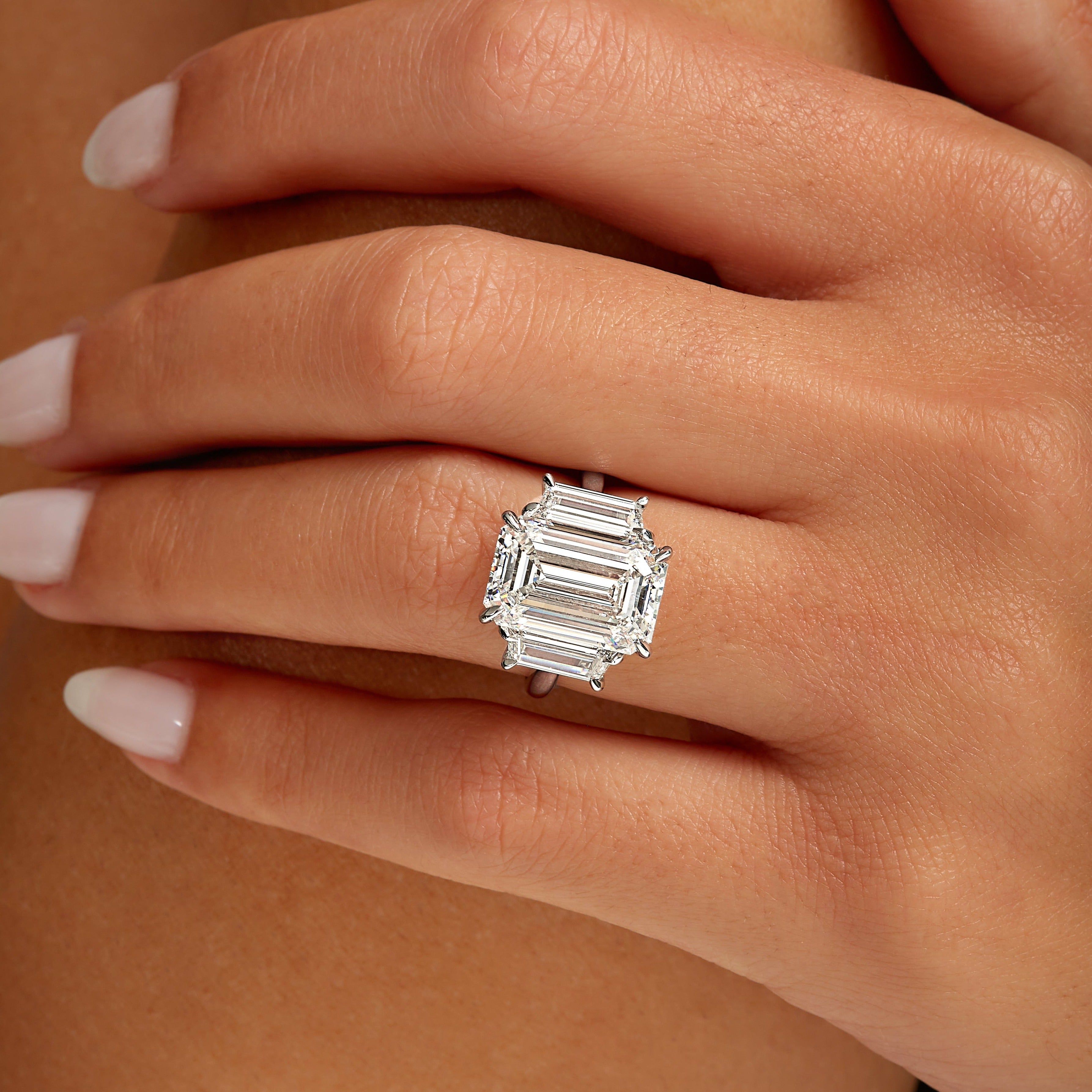 4.01ct Emerald Cut Diamond Three Stone Ring with Trapezoid Side Stones in Platinum Band, GIA Certified