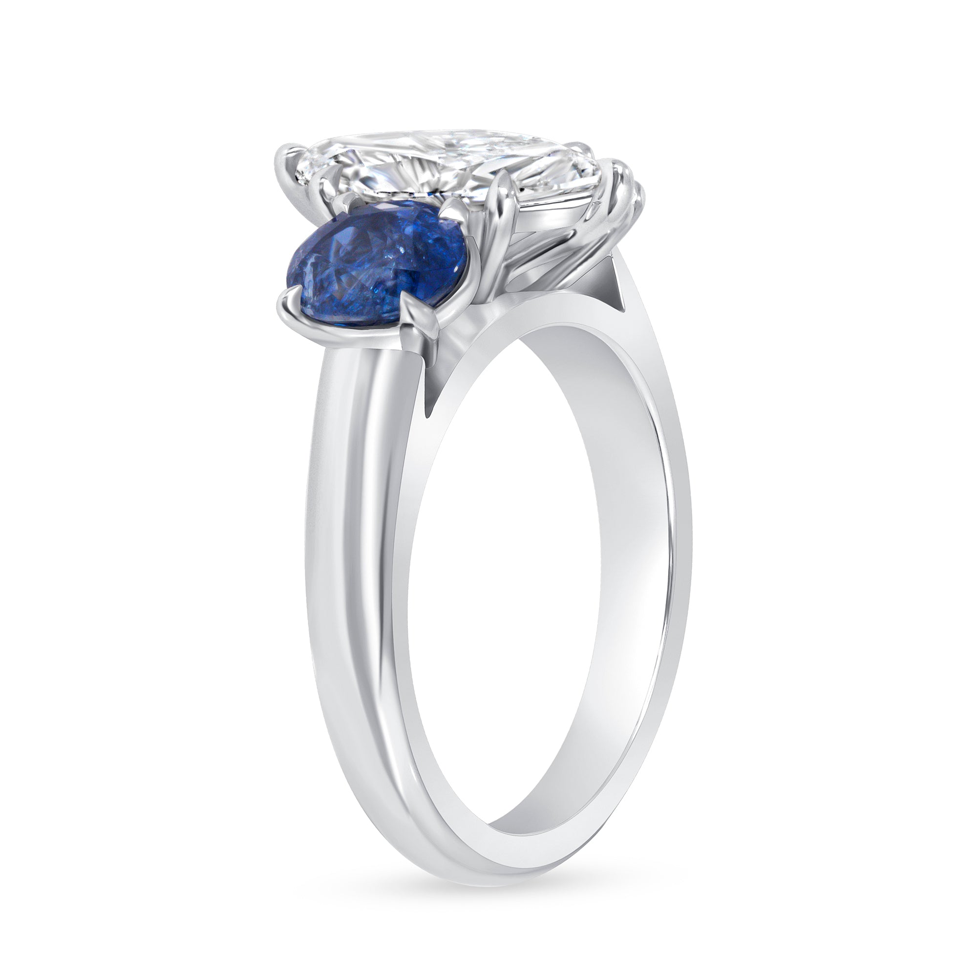 Marquise Cut Diamond and Blue Sapphire Three Stone Ring in Platinum