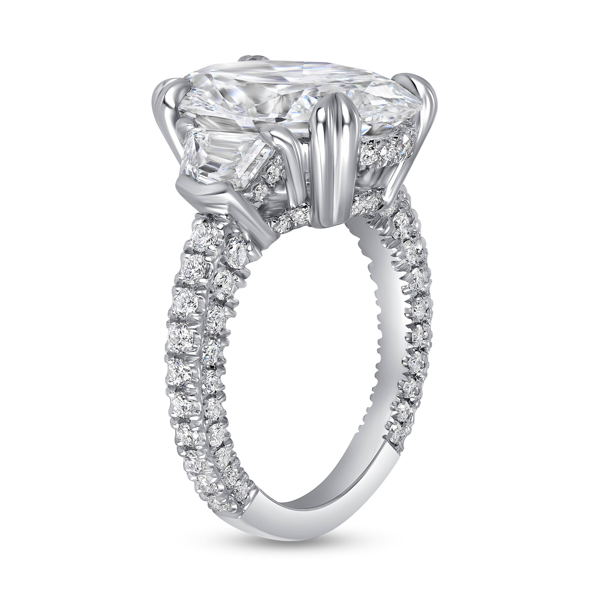 Oval Cut Diamond Three Stone Ring with Trapezoid Cut Diamond Side Stones in Platinum