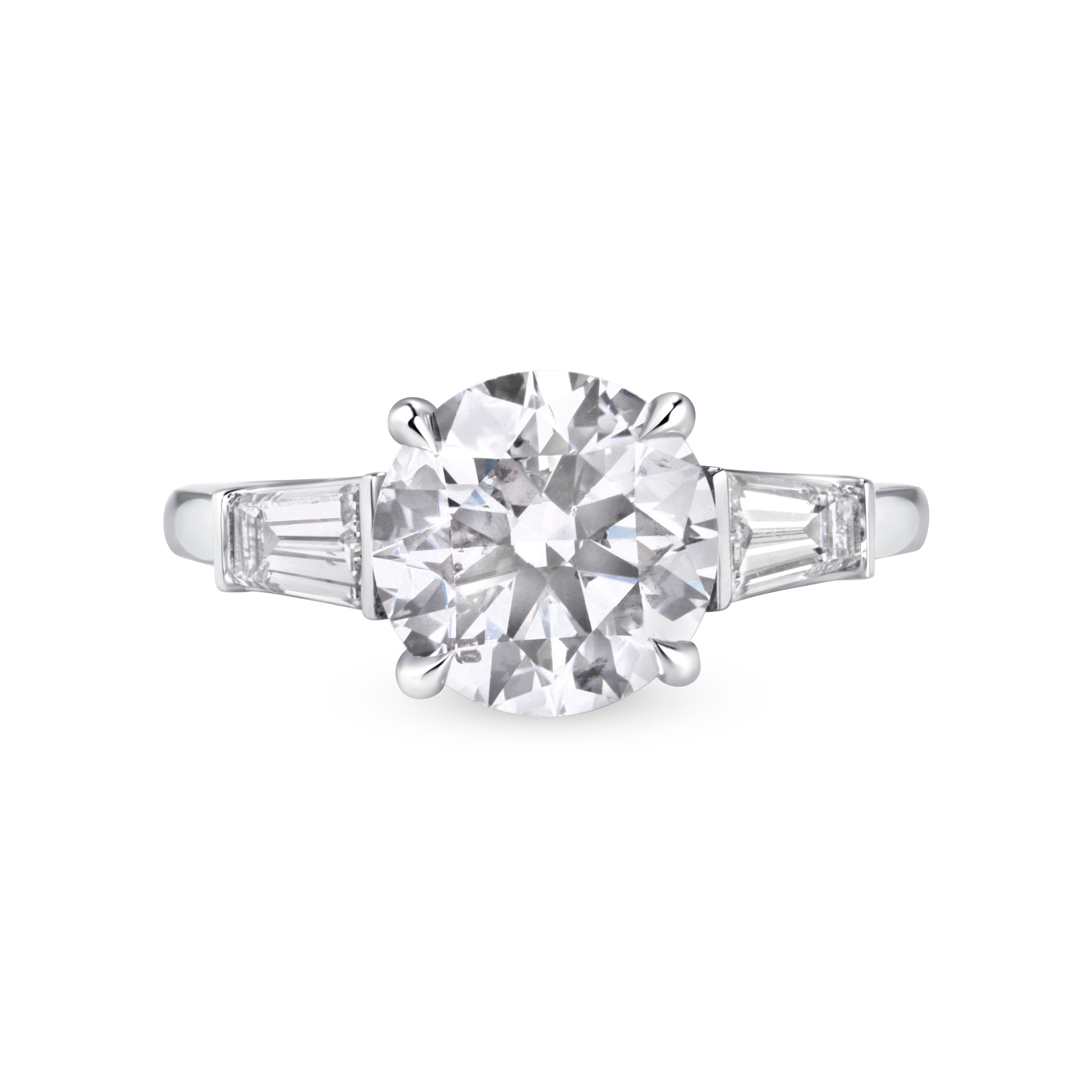 Round Brilliant Cut Diamond And Tapered Baguette Diamond Ring In Platinum Ruthenium