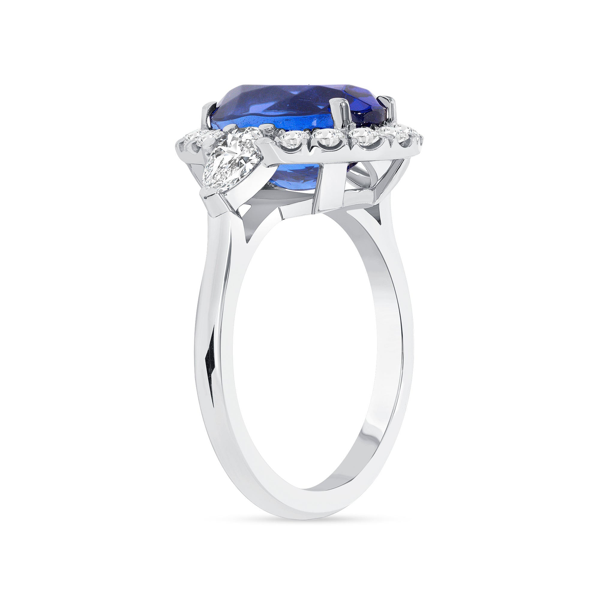 Tanzanite And Pear Shape Diamond Halo Ring In Platinum.