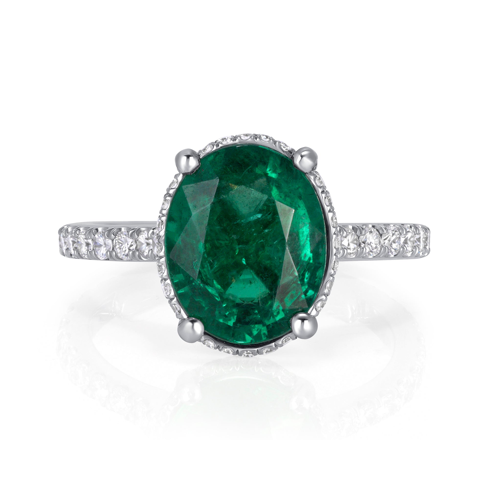 Oval Cut Emerald and Diamond Ring in Platinum