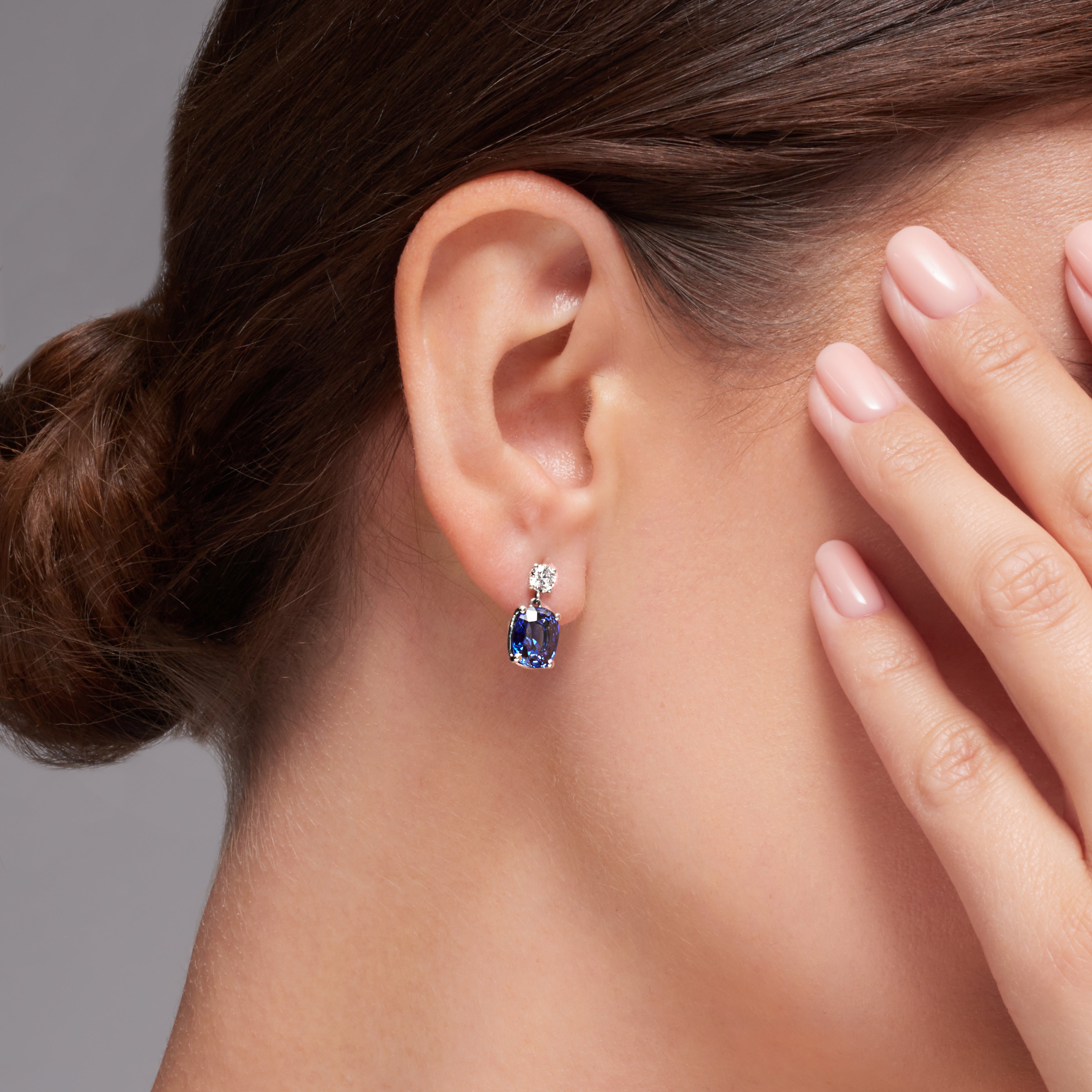 Blue Sapphire And Diamond Dangling Earrings In 18 Karat White Gold