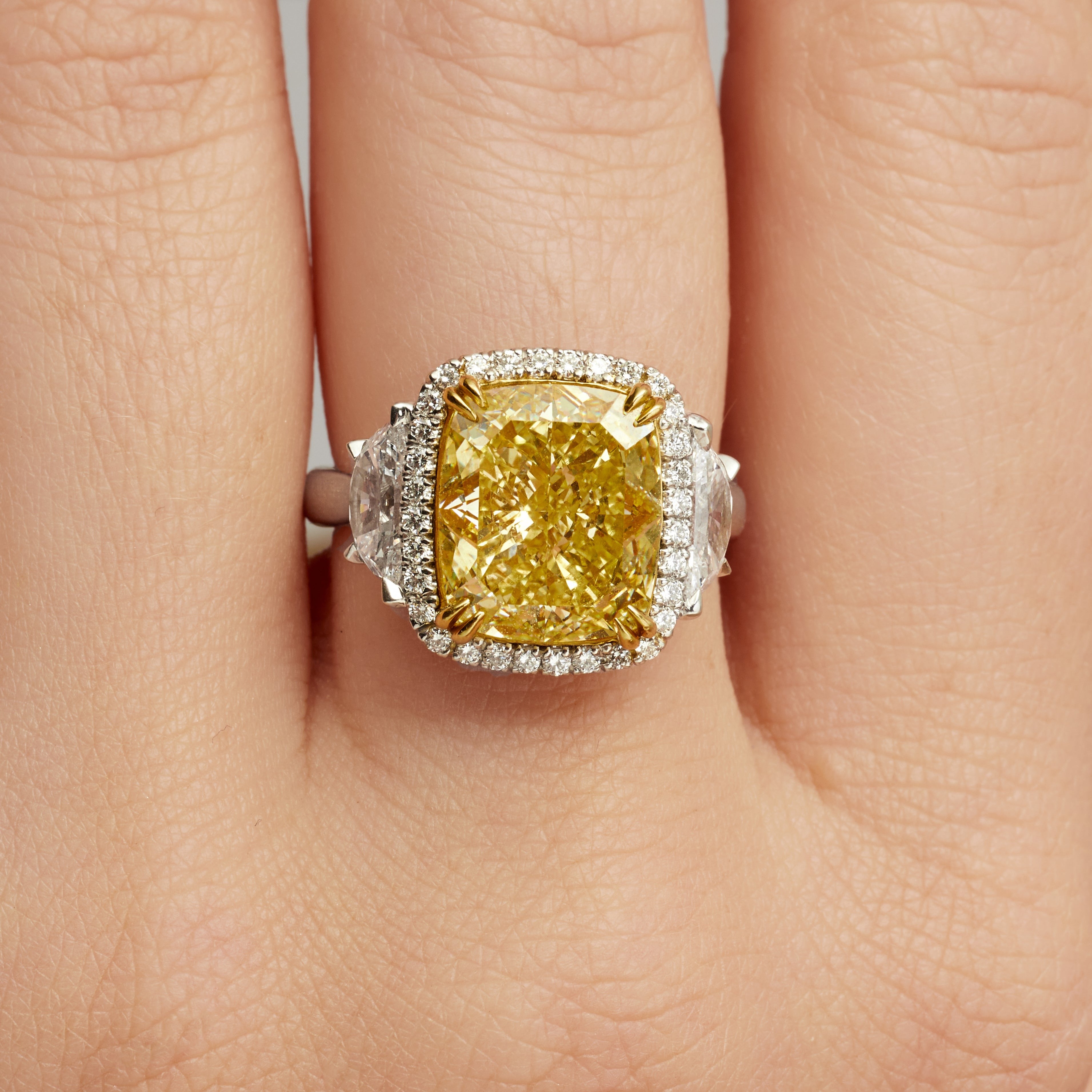 Cushion Cut Fancy Intense Yellow Diamond and Pavé Diamond Ring in 18 Karat Yellow Gold and Platinum