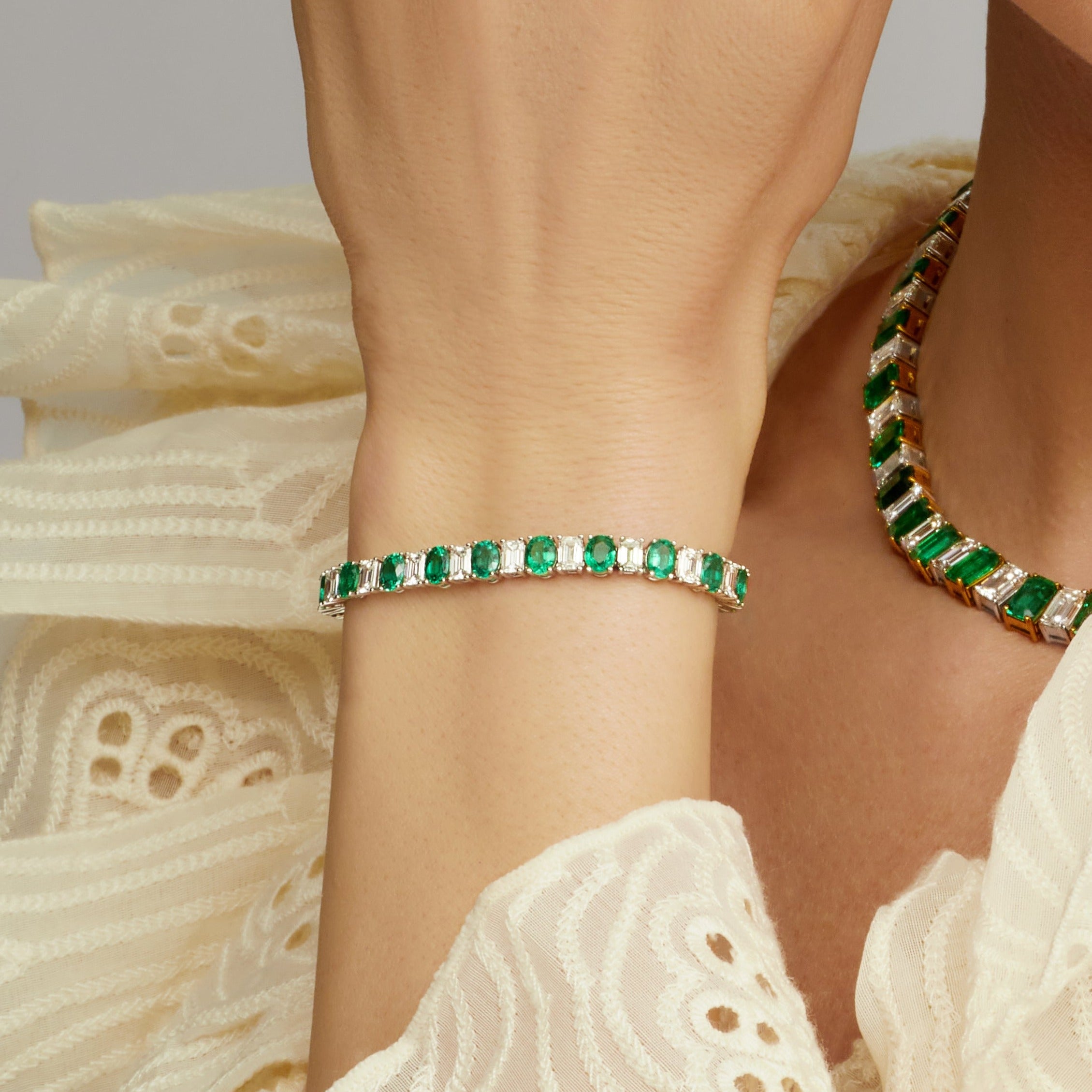 Alternating Oval Cut Emerald and Emerald Cut Diamond Tennis Bracelet in 18 Karat White Gold