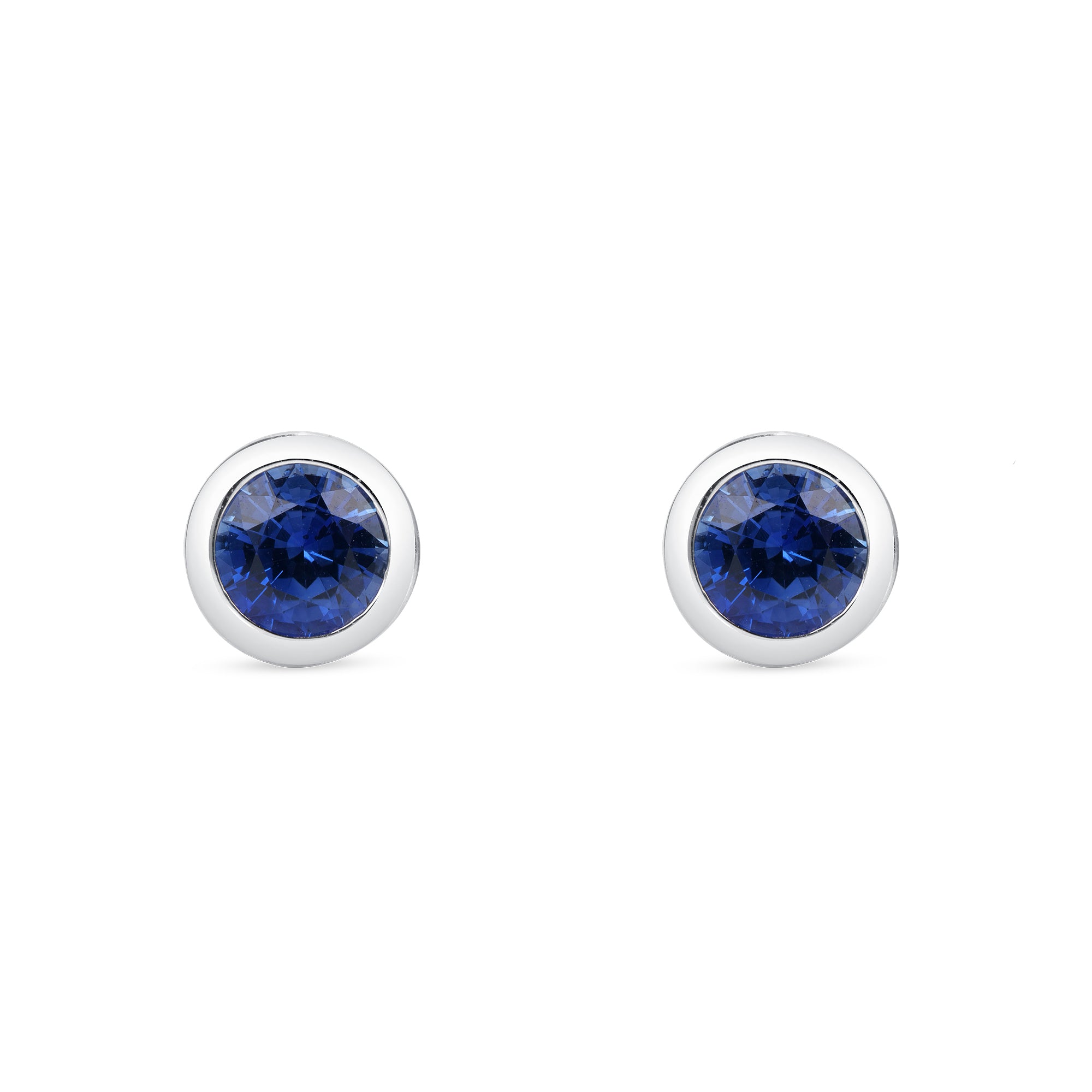 Blue Sapphire Bezel Set Earrings In 18 Karat White Gold