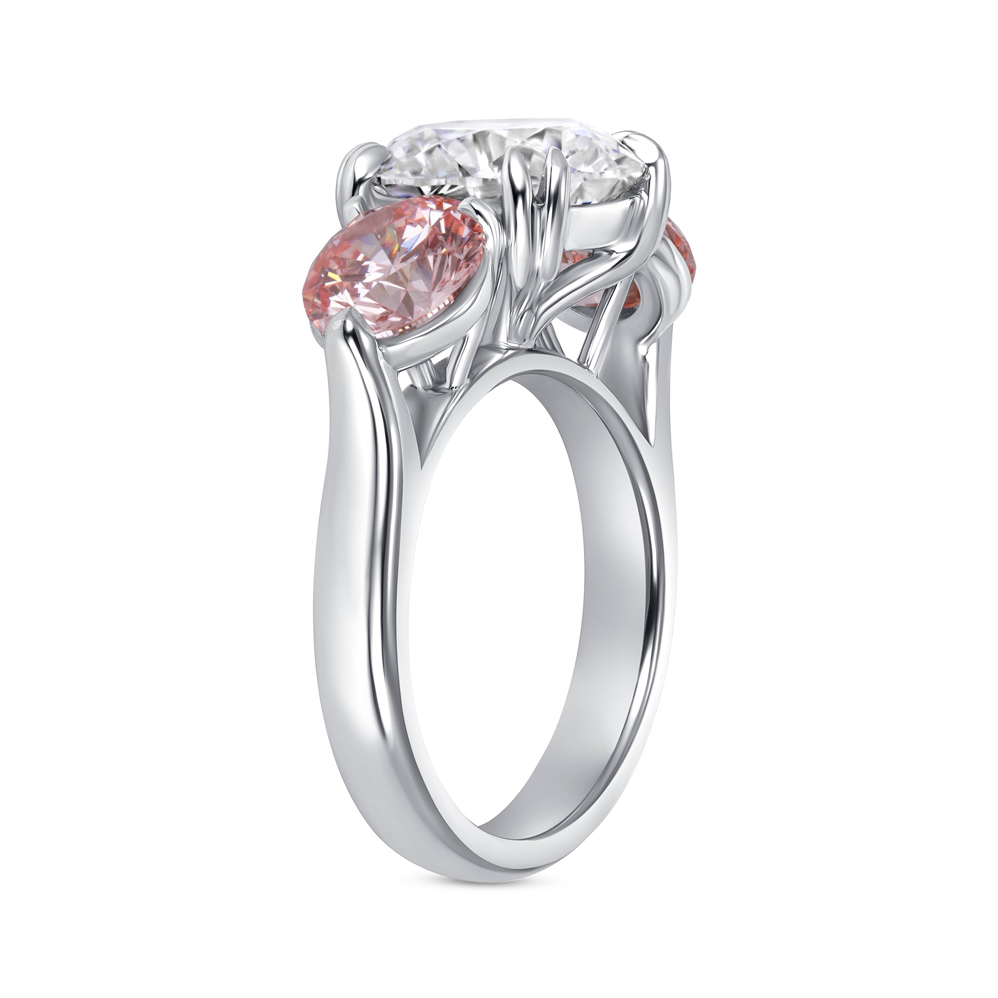 Round Brilliant White and Pink Diamond Three-Stone Ring in Platinum