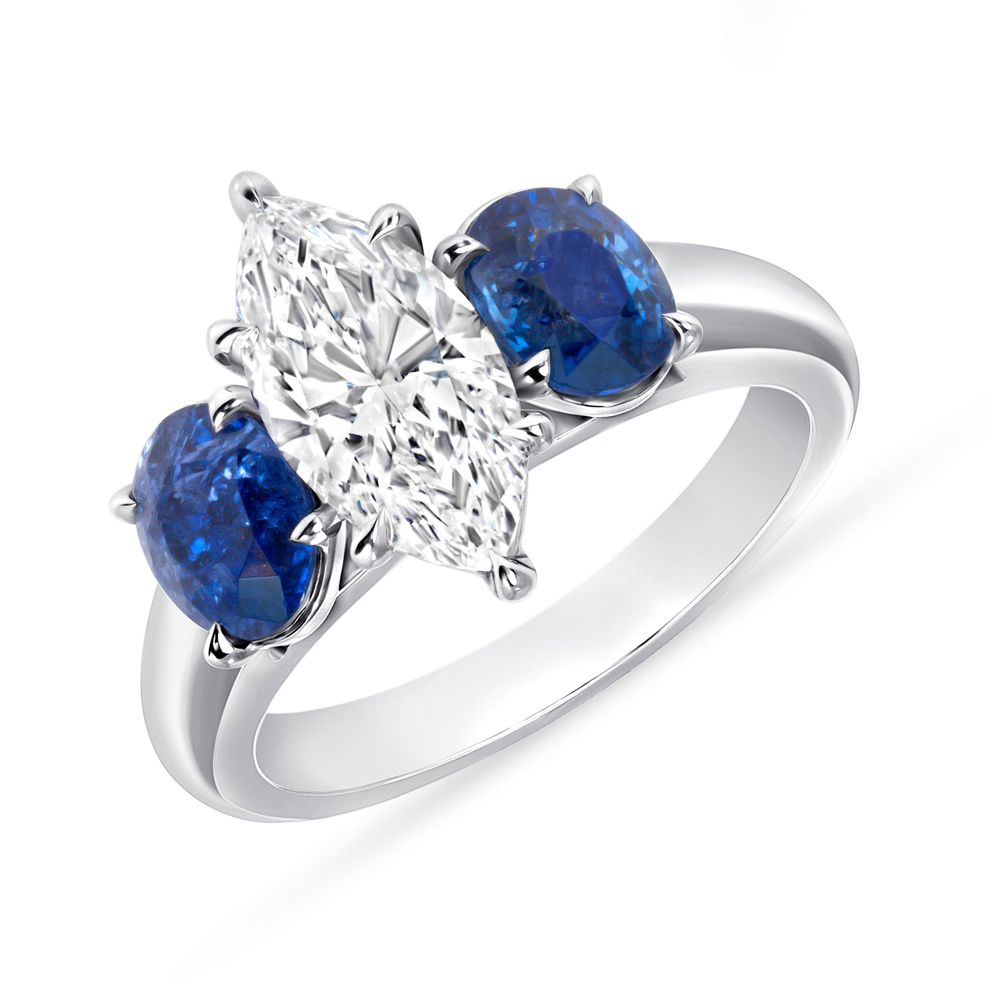 Marquise Cut Diamond and Blue Sapphire Three Stone Ring in Platinum